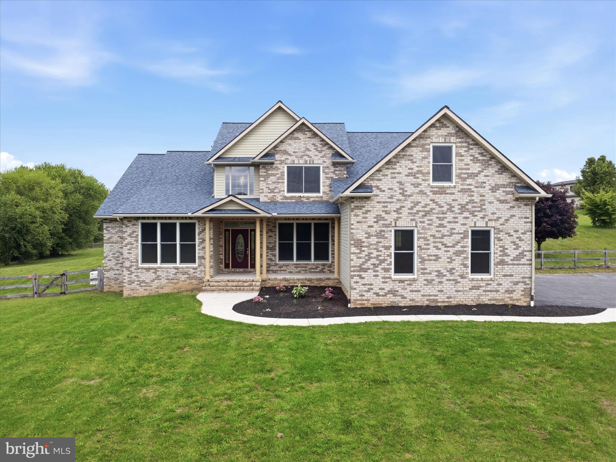 Country Living Meets Modern Convenience! 

Welcome home to this custom built 2 story colonial with a partial brick front set on 4.59 scenic acres. This spacious home offers space, flexibility, and exceptional amenities. It boasts over 4,200 square feet including the basement, an open floor plan, and a dramatic two story family room with a stunning stone wood-burning fireplace. The kitchen is well-appointed with granite countertops, a large island, abundant cabinetry, and a bright breakfast area, all flowing seamlessly into the main living spaces. The main-level owner’s suite provides convenience and comfort with a walk-in closet and private bath. Formal living and dining rooms, a welcoming foyer, main-level laundry, and a half bath complete the first floor. Upstairs, you’ll find a loft overlooking the family room, 3 generously sized bedrooms and 2 full baths, offering plenty of room for all of your needs. The unfinished basement offers excellent potential, featuring a rough-in for a future bath, walkout access to the exterior, and direct access to the garage. A French drain system and waterproofing provide added protection. Car enthusiasts and hobbyists will appreciate the 3-car attached garage plus an additional 2 car detached garage with workshop or hobby/music space - complete with electric and sound- proofing. The outdoor setting is equally impressive with a fenced yard, patio with pergola, chicken coop, play equipment, and a wood shed. Across the road you will enjoy the view of agricultural land and all of the wildlife that call this area home.  This owner has gone above and beyond with thoughtful upgrades and proactive planning to avoid any potential needs in the future.  Some of the highlights include a sand mound septic system (pumped and certified in 2024), owned 1,000 gallon buried propane tank, 200-amp service with 100-amp subpanel in the garage, and a generator. Major updates include roof (2025), HVAC (2023, 2-zone with app control), water heater (2023), windows (2023), water treatment system with reverse osmosis/UV/acid neutralizer (2020), radon system (2020), fresh paint (2026), and recently updated carpeting (2026). This amazing home is only a few miles to the Maryland line and minutes to Codorus State Park and Lake Marburg. This is one you won’t want to miss!!!