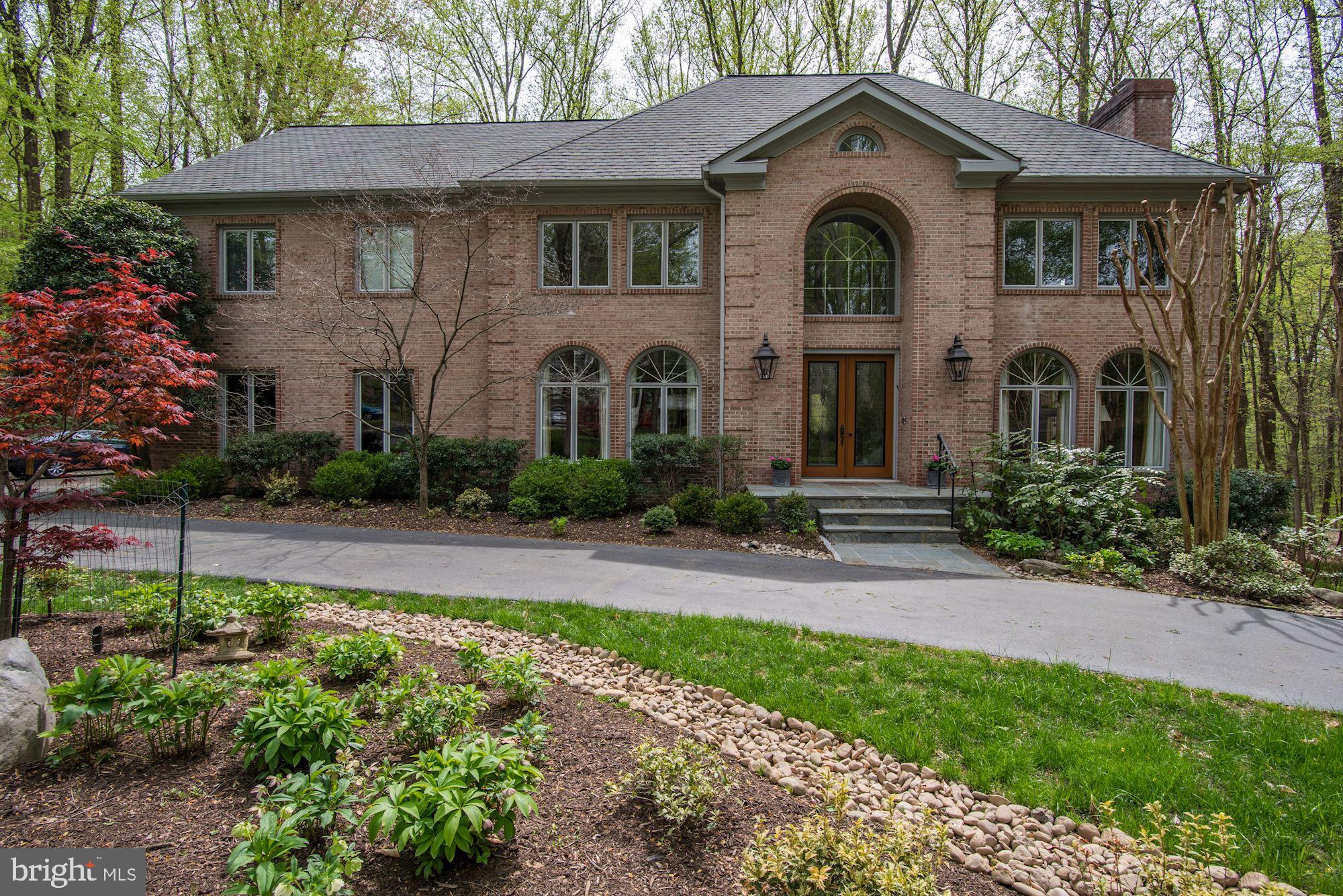 This street is one of Potomac's best kept secrets! Come see this private, quiet, non-cut through street with a stately all brick colonial.  Beautifully landscaped with specimen plantings, river rock and night lighting, this setting is spectacular.  This meticulously maintained, all brick colonial is wonderfully updated: Grand Manor Certainteed Roof,  new lower level furnace, quick recovery hot water heater; new Viking cooktop, stove, KitchenAid refrigerator and dishwasher.  Coveted 10' ceilings, large, double pane windows, travertine marble entry foyer & more! Daylight, walk-out, lower level awaiting your dreams - man cave? home theater-- you name it.  There's 2,500 SF waiting for your design.  Large two tiered deck overlooking picturesque backyard, side entry garage, circular driveway.  These owners have thought of everything!  Close to C&O Canal.  Whitman Cluster