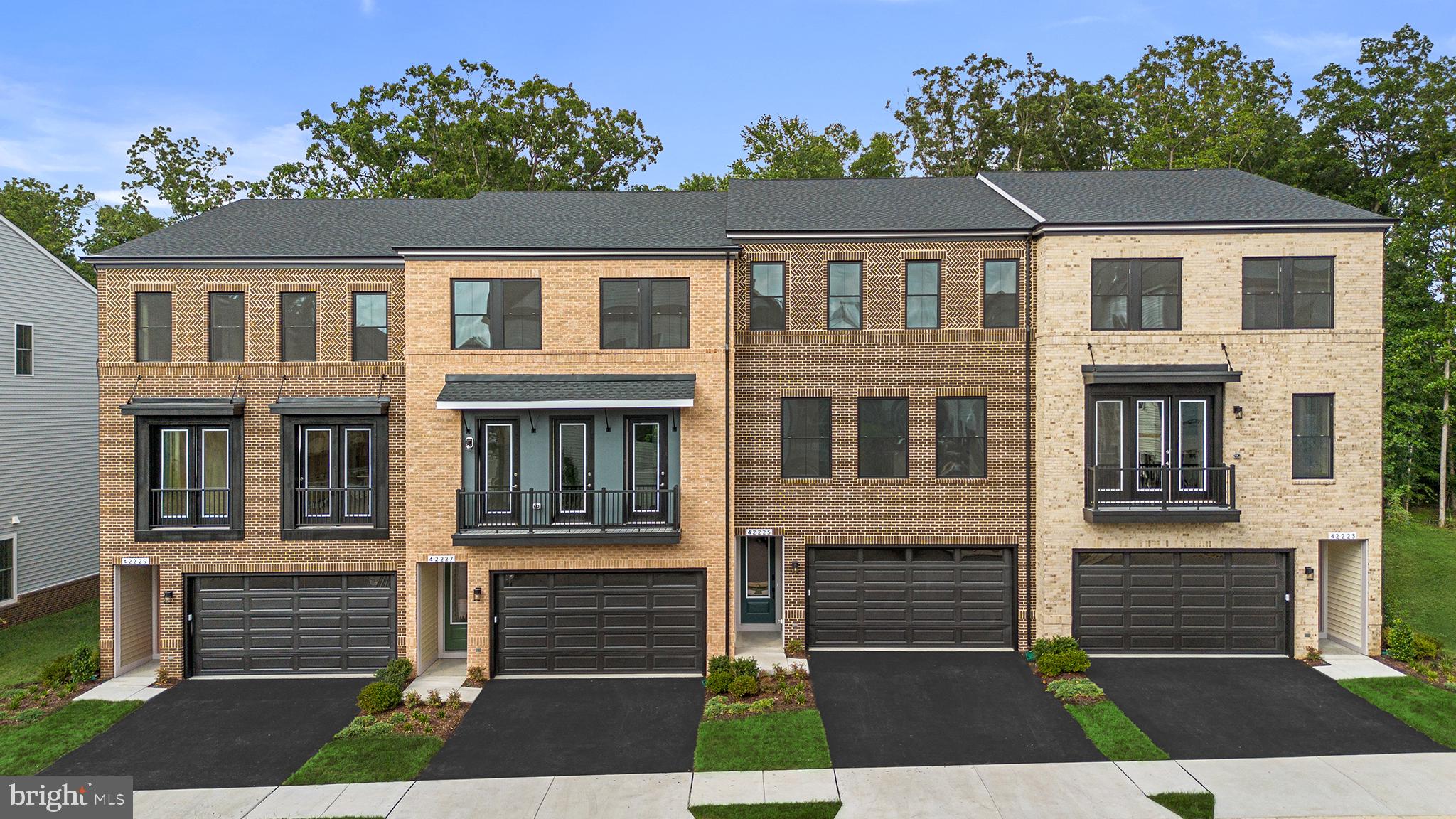 Find a MOVE-IN READY, END TOWNHOME at West Park III by Van Metre Homes in Brambleton, VA with a two-car, front-load garage with an electric vehicle charging circuit, three bedrooms, three full bathrooms, and one half bathrooms. With over 2,700+ finished square feet across three levels, this residence welcomes you 9 ft. ceilings on all levels and LVP luxury vinyl plank flooring in the main areas. This floorplan features a private backyard, a spacious deck, and a balcony off the great room for outdoor living. The open-concept main level offers a heart-of-the-home kitchen and a great room with an electric fireplace, while a nook off the dining area adds a flexible space. The primary suite features a spa-inspired four-piece bathroom complete with dual vanities, a linen closet, and a frameless shower enclosure with floor-to-ceiling tile and a built-in seat. This level also includes two additional bedrooms, a full bathroom, and a conveniently located laundry room. On the lower level, enjoy a walkout rec room with two additional storage closets and a full bathroom perfect for guests, a home office, hobbies, or a flexible living space. This home is on a corner lot which backs to trees and has a rear yard. Additionally, the home is solar-ready. Being a new build, your home is constructed to the highest energy efficiency standards, comes with a post-settlement warranty, and has never been lived in before! Take advantage of closing cost assistance by choosing Intercoastal Mortgage and Walker Title. Self-schedule a tour today by visiting our website or get in contact with a Van Metre Sales Advisor for more details.----- Welcome to West Park III, a vibrant neighborhood of dreamy townhomes with rooftop terrace options in the award-winning community of Brambleton, VA. Experience an exceptional living experience in Brambleton, a flourishing community where modern living meets suburban charm. This family-friendly community offers miles of trails, tot lots, parks, pools, highly sought-after schools within walking distance, and so much more at your fingertips. With the bustling Brambleton Town Center just down the street, you can enjoy endless shopping, dining, and entertainment options. Rise to new heights at West Park III and experience the perfect blend of comfort, convenience, and connectivity—a place where cloud nine is just the beginning. -----*NterNow self-touring is available on select homesites at West Park III, no agent or appointment required. Buyers may visit independently during daylight hours. For access instructions and availability, contact Van Metre Homes directly or visit our website.-----*Other homes sites and delivery dates may be available. Pricing, offers, and availability are subject to change without notice. Images, renderings, and site plans are for illustrative purposes only and may not reflect actual homes or features. Some renderings may depict a similar home. Additional terms and conditions may apply. West Park III lies within the Airport Impact Overlay District (entirely within 1 Mile Buffer). Due to its proximity to Dulles International Airport, this site is subject to aircraft overflights and aircraft noise. Please see a Van Metre Sales Advisor for details.