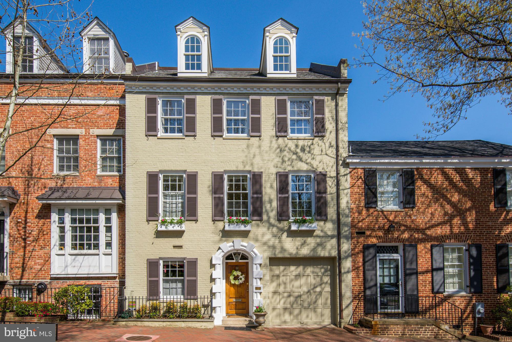 Beautiful brick Federal townhouse in the heart of Georgetown w/ attached GARAGE. This home features 3BR, 3FB, 2HBA and hardwood floors, crown-molding, and exposed brick. There is a stunning two level atrium which floods the house with natural light. The rear exterior has an exquisite garden and a brick patio w/ multiple spaces for entertaining or relaxing and a roof deck with spectacular views!