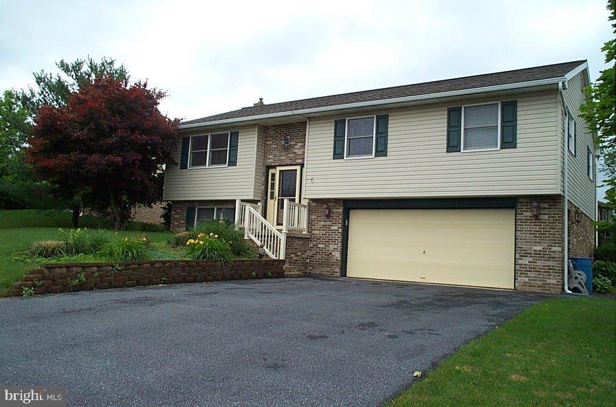 Well kept home in quiet neighborhood setting, 3 bedrooms 2 1/2 baths, lower level family room with fireplace, large laundry room with ceramic tile.  Newer appliances, corian counters and ceramic tile in kitchen, 2-tier deck and hot tub for entertaining.