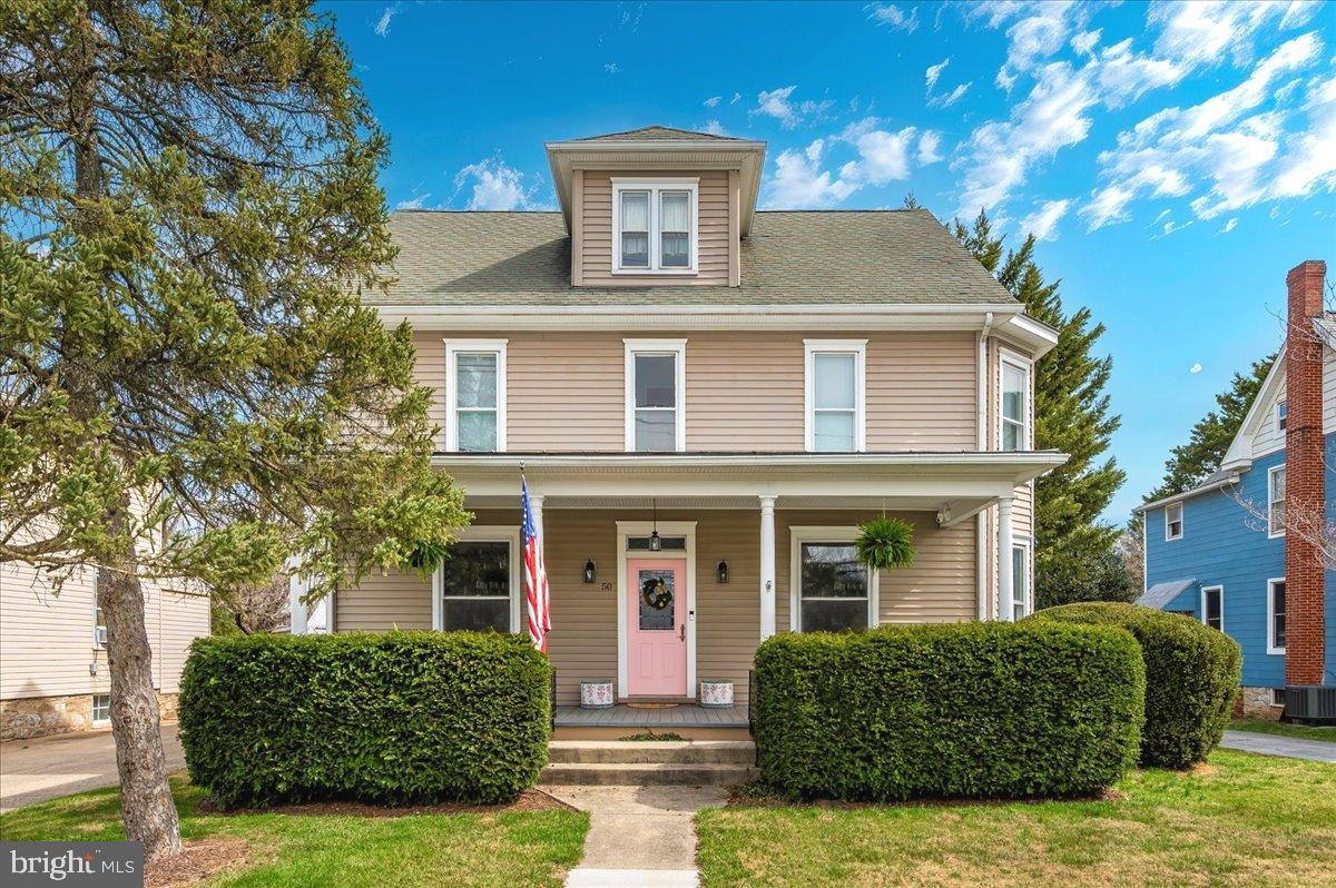 A stunning turn-of-the-century home seamlessly blending historic charm with modern conveniences in the heart of Downtown Walkersville! This move-in-ready beauty boasts a classic floor plan featuring original woodwork, hardwood floors, and an updated primary bathroom. The spacious, light-filled interior includes a generous living room, family room, dining room, and a full bath on the main level.
Upstairs, you’ll find large bedrooms, including a well-appointed primary suite with a generous built-in closet. A walk-up attic offers excellent potential for additional living space. The fully finished walk-up basement, complete with LVP flooring and a full bath, makes for a perfect in-law suite or potential 5th bedroom. Dual-zoned HVAC ensures year-round comfort.
Enjoy relaxing on the expansive Trex-decked front porch or hosting gatherings in the private backyard, which features a partially covered flagstone patio. The property also includes a detached one-car garage, maintenance-free outbuildings with electricity, and a charming historic outhouse. This home is the perfect blend of history, character, and modern comfort—don’t miss this incredible opportunity.