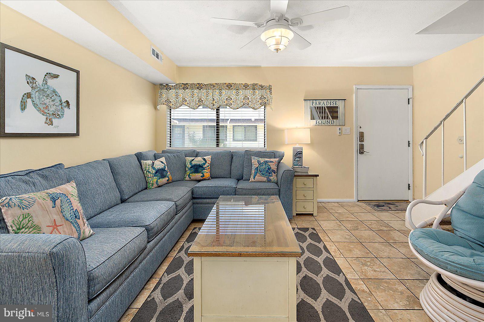 Welcome to your perfect beach getaway! This charming 2-bedroom, 1.5-bath canal-front home offers boat tie-up and comes fully furnished—just bring your bags and start enjoying coastal living. The open-concept main level features bright living spaces, ceramic tile flooring, and an updated kitchen with upgraded countertops. Step outside to your private fenced patio, ideal for summer crab feasts and relaxing evenings. Enjoy the waterfront community pool and a prime location just minutes from the beach, dining, shopping, and entertainment.