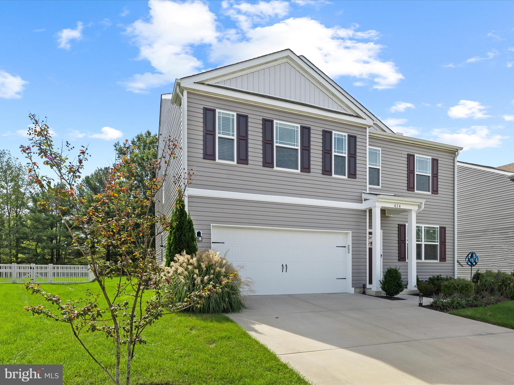 Welcome to this spacious four-bedroom contemporary home in the sought-after, community of Rowen's Mill. With attractive curb appeal and a thoughtfully designed layout, this home effortlessly blends style, comfort, and functionality.

Step inside to find a dedicated office to your right, perfect for working from home or managing household tasks. Continuing down the hall, the formal dining room, currently used as a home gym offers flexibility to suit your lifestyle. The open-concept heart of the home features a bright kitchen, breakfast nook, and living room, ideal for both everyday living and entertaining. The kitchen boasts crisp white cabinetry, stainless steel appliances, granite countertops, gas cooking, a walk-in pantry, and a window over the sink overlooking the backyard. Slider doors from the breakfast nook provide seamless access to the rear yard, while the living room features a cozy corner gas fireplace. Luxury vinyl plank flooring flows throughout the first level, complemented by multiple closets and convenient access to the two-car garage.

Upstairs, a spacious loft area provides the perfect setting for a family game room or additional living space. The primary suite is a serene retreat with a large walk-in closet and private en suite bath. Three additional bedrooms, a full hall bath, and a roomy laundry area complete the second level. Many rooms feature recessed lighting, and window blinds add both style and privacy.

The backyard is generous and backs to a tree line, with neighboring fencing on either side for added privacy, perfect for outdoor gatherings or quiet relaxation. As part of Rowen's Mill, residents enjoy a vibrant lifestyle with access to walking trails, a clubhouse, and a sparkling community pool, all just steps from the front door.

This move-in-ready home offers modern finishes, versatile spaces, and a convenient, community-oriented location, truly a must-see for anyone seeking the perfect balance of comfort and contemporary living.