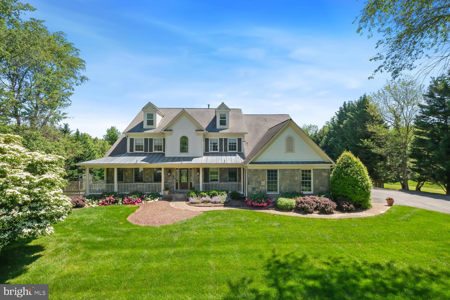 ************PRICE REDUCTION*************NEW ROOF AND SKYLIGHTS JUST INSTALLED!.***********
Don't miss the opportunity to call this extraordinary retreat your home. Located just seven miles from  Potomac Village yet worlds away from traffic and noise. Sited on a picturesque 5-acre lot in a peaceful neighborhood, this stunning 5-bedroom, 5.5-bathroom colonial home epitomizes luxurious living. The main level dazzles with a gourmet kitchen, complete with granite countertops, two refrigerators, two dishwashers, a six-burner range, an additional beverage fridge, wine fridge, and ice maker. The inviting breakfast area opens onto a spacious deck, perfect for watching beautiful sunsets on summer evenings. The family room exudes warmth with rich mahogany wood paneling, a magnificent mahogany bar with wine fridge and sink, and a cozy stone fireplace, perfect for relaxing or hosting a party to watch a game. The main level also includes a bright and light living room, a dining room, with a bay window,  a  private study, and a mudroom/laundry room. The upper level is a sanctuary with a grand primary bedroom featuring two large walk-in closets and a luxurious primary bath with a soaking tub, separate shower, and water closet. Three additional bedrooms and two full bathrooms provide ample space for family and guests. The top floor offers two more bedrooms with new carpet and a full bathroom, ideal for privacy and comfort. The lower level is designed for entertainment and wellness, boasting a large recreation room with new LVT flooring, recessed lights, and level walk-out access. A yoga/exercise room, bonus room, and full bathroom add to the home's versatility. Outside, the beautifully landscaped grounds include a sparkling pool, a sport court, and a putting green, creating a private oasis for relaxation and recreation. A  garage ( 2 spaces for cars, 1 space for storage/work space)  completes this exquisite property, seamlessly blending luxury, comfort, and style.  The property is equipped with a whole-house self-cleaning water filtration system, a Generac whole-house generator, and a new roof installation is underway, ensuring peace of mind and convenience.  
Home and pool are being sold "as is"