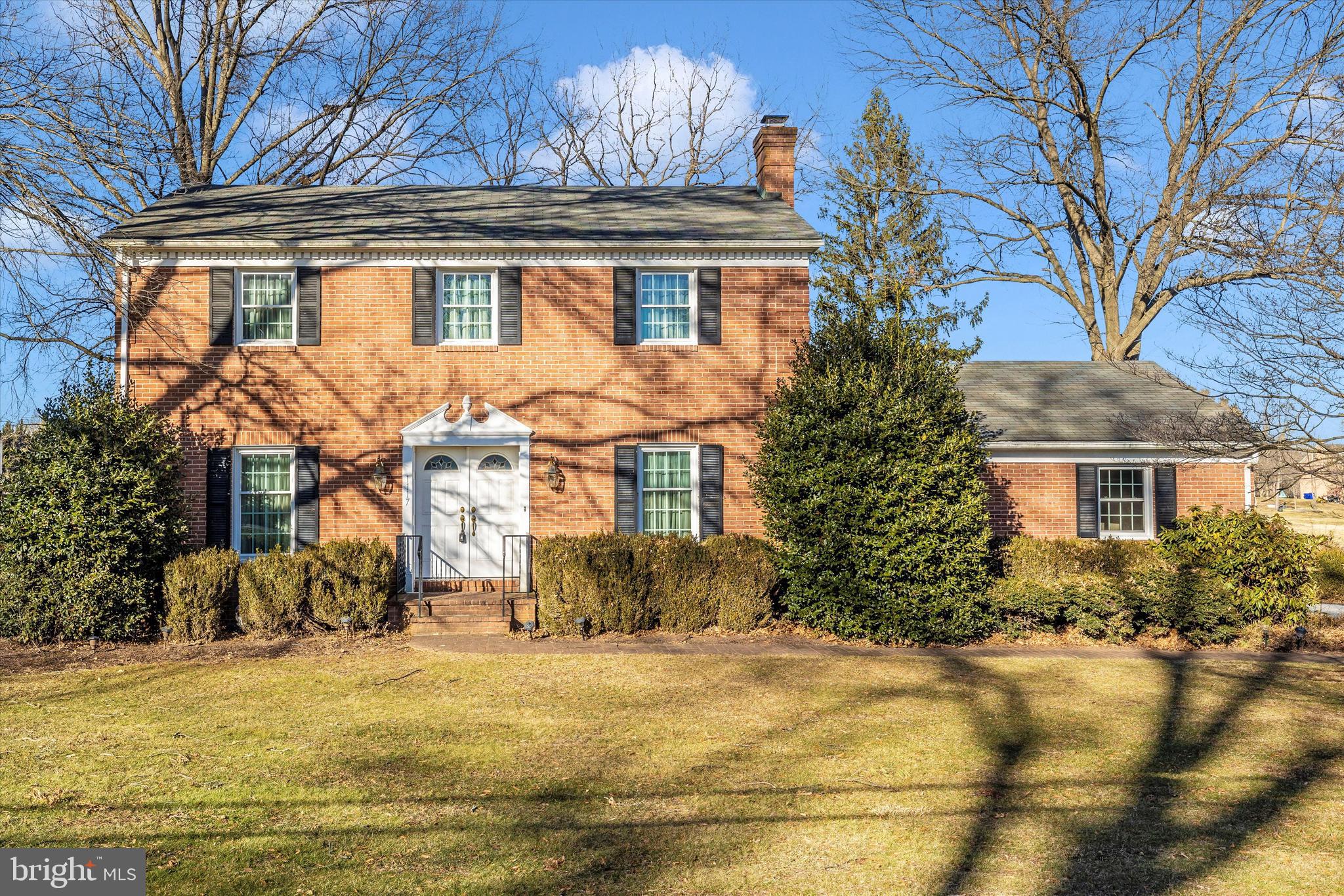 Welcome to this beautiful, Ausherman original, all brick colonial located on an acre of land with mature trees. Upon entering the double doors you find a formal dining room on the left and a formal sitting room on the right (easily converted to a main level bedroom). The eat in kitchen leads to a spacious family room with vaulted ceiling, a floor to ceiling stone fireplace and sliders that open onto a slate patio. For your convenience a main level laundry/ mudroom and full bath sits adjacent to the kitchen. The hardwood stairs deliver you to three spacious bedrooms with ample closet space and two full baths. Waiting for your finishing touches, downstairs you'll find another stone fireplace, family room and wet bar. Look past the wall paper to put your finishing touches on the quintessential Frederick home with no HOA. Conveniently located near major commuting routes, shopping, restaurants and downtown Frederick.