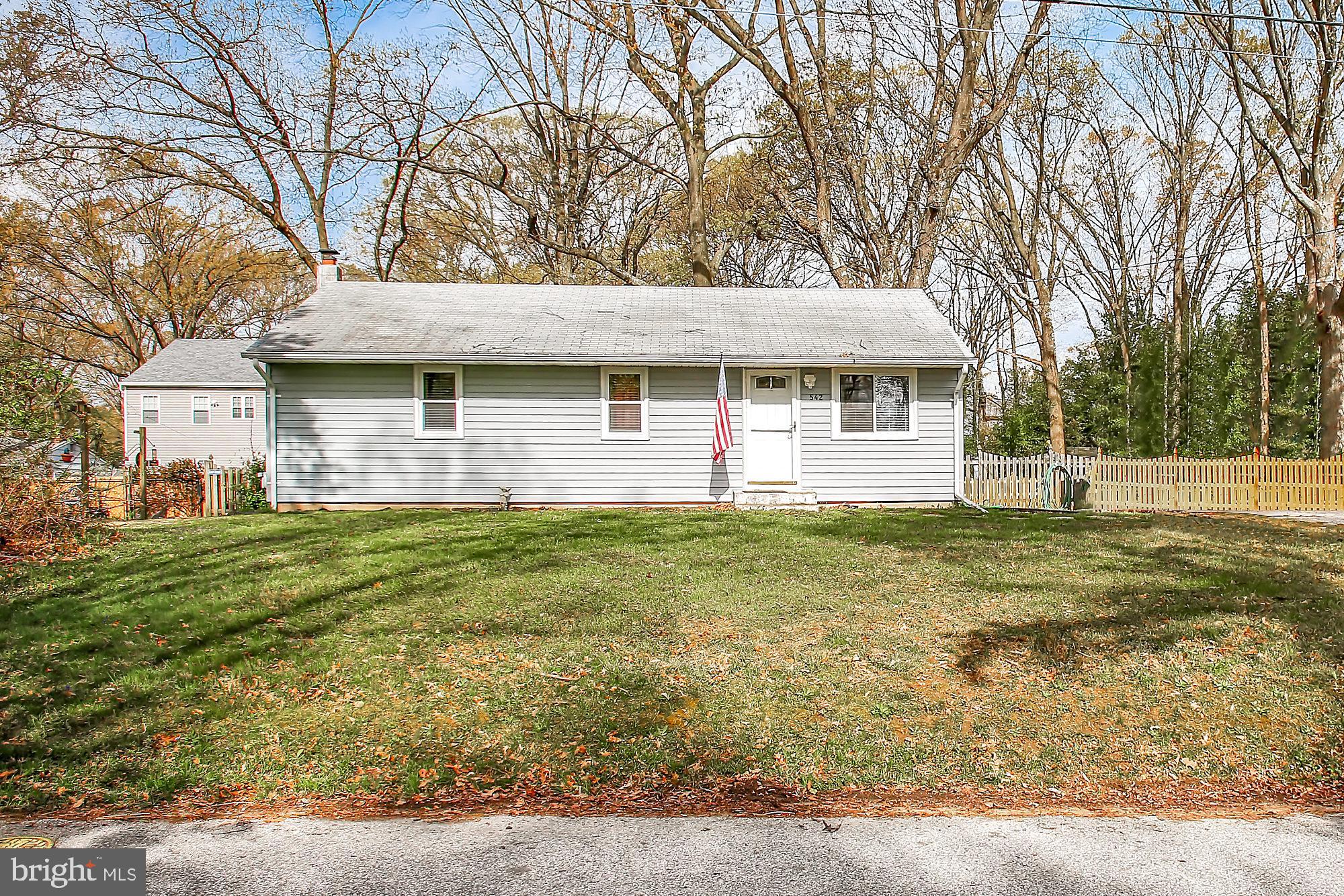 NEW PRICE $320,000!  Located in the highly sought after Severna Park School District.  Home is situated close to Benfield Road with a buffer of trees, sitting up on a small hill and back off the street, the 2nd lot in on Arundel Drive, which is a great location for walking to schools, religious facilities, grocery store, shops, restaurants!   One of the largest lots in Carrollton Manor has plenty of room for an addition or garage if desired.  Long time owner raised her children here and enjoyed many years in the completely fenced back yard.  This great home features 3 bedrooms, 2 full bathrooms, refinished hardwood floors on the main level, brand new finished family room in the basement, brand new gorgeous full bathroom in basement, newly remodeled main level full bathroom,  brand new tile floor in kitchen, new stove, new refrigerator, new dryer, 6 ceiling fans throughout, new HVAC, rear deck off of kitchen for cookouts, corner lot, Home Warranty, the list goes on!  The finished lower level could make for a great in law suite.  Basement has been professionally waterproofed.  All appliances convey.  Community offers beaches and boat ramp for a voluntary fee.  Rare .30 acre lot in Carrollton Manor.  Convenient commuter location to DC/Annapolis/BWI.  Be sure to check out http://carrolltonmanor.us to learn more about the community.