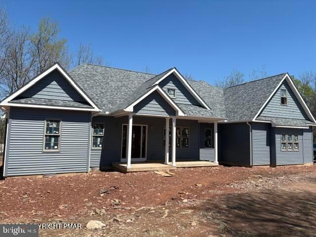 Mountain Retreat designed for living. Currently under construction with high-end upgrades throughout, this stunning 4-bedroom, 3 1/2 bath custom ranch blends luxury, comfort, and versatility in one exceptional package. Thoughtfully designed for modern living, this home features spacious open-concept living areas, a beautiful electric fireplace in the living room, a basement with endless possibilities, a two car garage, and efficient heat pump heating and central air conditioning for year round comfort. What truly sets this home apart is its unique layout. With two beautiful first-floor bedroom suites, there is room for multigenerational living, private guest accommodations, or premium short-term rental appeal. Above the garage, a private second-level suite creates a retreat of its own -- complete with a spacious bedroom, private bathroom, and its own living room -- perfect for extended family, guests, or a luxury Airbnb experience. Set inside an amenity-rich community, everyday living feels like vacation. Residents enjoy access to sparkling lakes, sandy beaches, swimming pools, tennis courts, clubhouse gatherings, and convenient trash pickup -- all creating a true resort-style atmosphere. Location only adds to the appeal. Ideally situated near world-class ski resorts, exciting casinos, shopping, dining, and year-round recreation, this property is perfectly positioned for both personal enjoyment and investment potential. Whether you're searching for a dream primary residence, a vacation getaway, or an income-producing Airbnb opportunity, this home checks every box -- luxury, location, amenities, and unmatched versatility. This isn't just a house under construction -- it's a future destination.