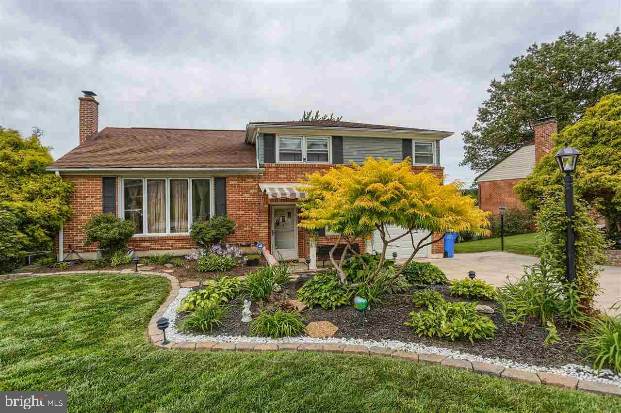 Beautifully maintained move-in condition split level, outstanding curb appeal! So many wonderful surprises in/out. Looking to entertain yr round? Search no more! Welcoming flag stoned foyer, shiny HW flooring, FP, corner windows, updated baths. Custom built decking w/ BONUS bldings: over-sized shed & unique multi-purpose in/outdoor rm w/ unlimited uses. Ideal for hot tub, kids playhouse. Imagine relaxing by your 1 of a kind pond surrounded by a spectacular garden. Retractable awning @ front entrance.