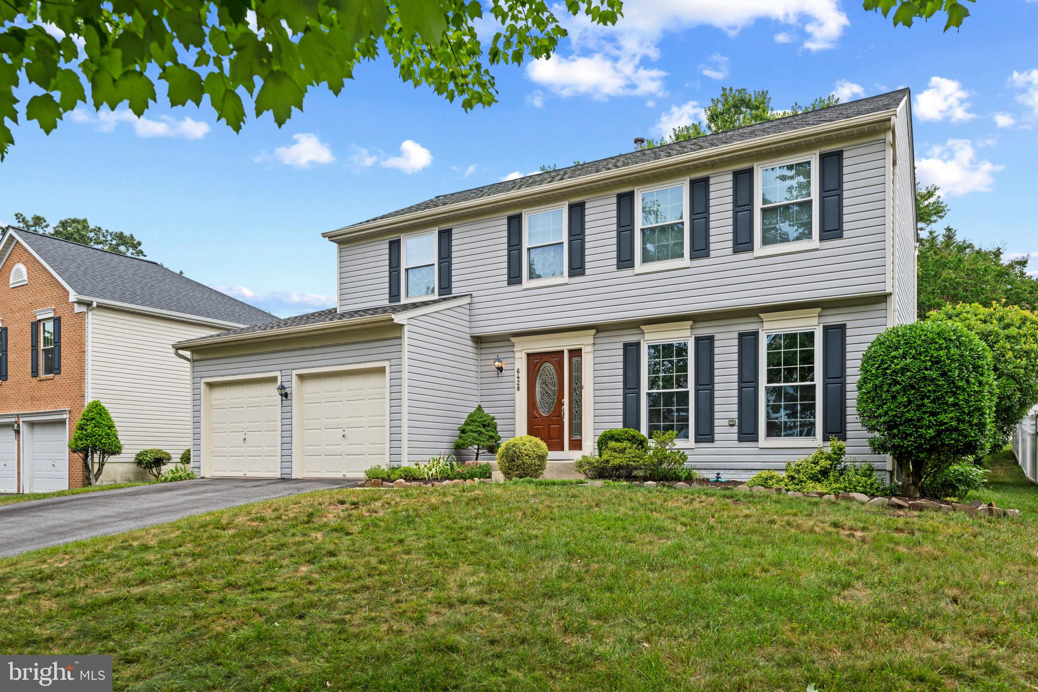 Beautifully maintained Colonial residence offering 4 bedrooms, 2 full bathrooms, 1 half bathroom, and an attached 2-car garage, tucked away on a quiet street in desirable Willowood. // Inside, rich hardwood flooring, newly installed carpeting, and fresh paint create a bright, move-in-ready atmosphere. The traditional main level begins in the welcoming foyer and flows into a spacious formal living room, where oversized windows fill the space with natural light. The adjoining formal dining room provides an elegant setting for special occasions. // The updated eat-in kitchen is thoughtfully designed with timeless white shaker-style cabinetry, chic black and white appliances, a pantry, and abundant workspace. An adjacent breakfast area features sliding glass door access to a delightful sunroom, complete with panoramic sliding glass doors and a ceiling fan, creating a seamless transition between indoor and outdoor living. Just across from the breakfast area, the generously sized family room offers the perfect place to unwind and entertain. // Newly installed carpeting extends throughout the upper-level bedrooms, including the spacious owner's suite featuring a walk-in closet and a beautifully renovated private ensuite bathroom. The luxurious bath showcases a dual-sink vanity, a glass-enclosed shower adorned with elegant tilework, and a built-in bench for added comfort. Three additional bedrooms and a second full bathroom provide plenty of space for family, guests, or a home office. // The finished lower-level recreation room offers flexible living space ideal for a media room, playroom, fitness area, or hobby space. Multiple storage rooms provide exceptional organization while also housing the washer and dryer. // Outside, the sunroom opens to a custom stone patio featuring a built-in fire pit and retaining wall, creating the perfect setting for outdoor entertaining, gathering with friends and family, or simply relaxing while enjoying peaceful evenings in the beautifully landscaped backyard. // Select photos have been virtually staged for illustrative purposes only.