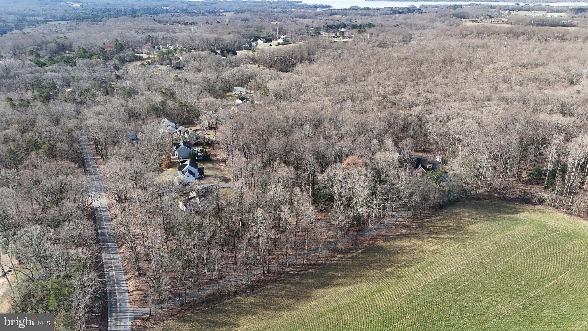 This 11.32-acre property in Donnaray Woods, Calvert County, Maryland, offers privacy, road frontage, and excellent wildlife habitat. While it is one parcel, it is divided into two sections separated by an entrance—the first section sits closer to Lower Road for easy access, while the larger section extends further back, providing a more secluded and elevated setting. Designated as Open Space, the forest retention area is protected from development, ensuring a preserved natural environment. The property features diverse terrain, with some rolling elevation changes that create natural funnels for wildlife movement. The front section has a gentle slope leading into the wooded acreage, while the back section rises in elevation, offering a mix of high ground and natural ridges—prime locations for wildlife travel corridors. Whitetail deer activity is abundant, with scrapes and rubs scattered throughout the timber. A mix of mature hardwoods and thick cover provides excellent bedding and habitat. With substantial road frontage on Lower Road, the property is easily accessible yet still offers seclusion. This is a solid investment for hunting and recreation. Whether you’re looking for a hunting and rec property or a long-term investment, this Calvert County land presents a unique opportunity with prime terrain and diverse elevation.