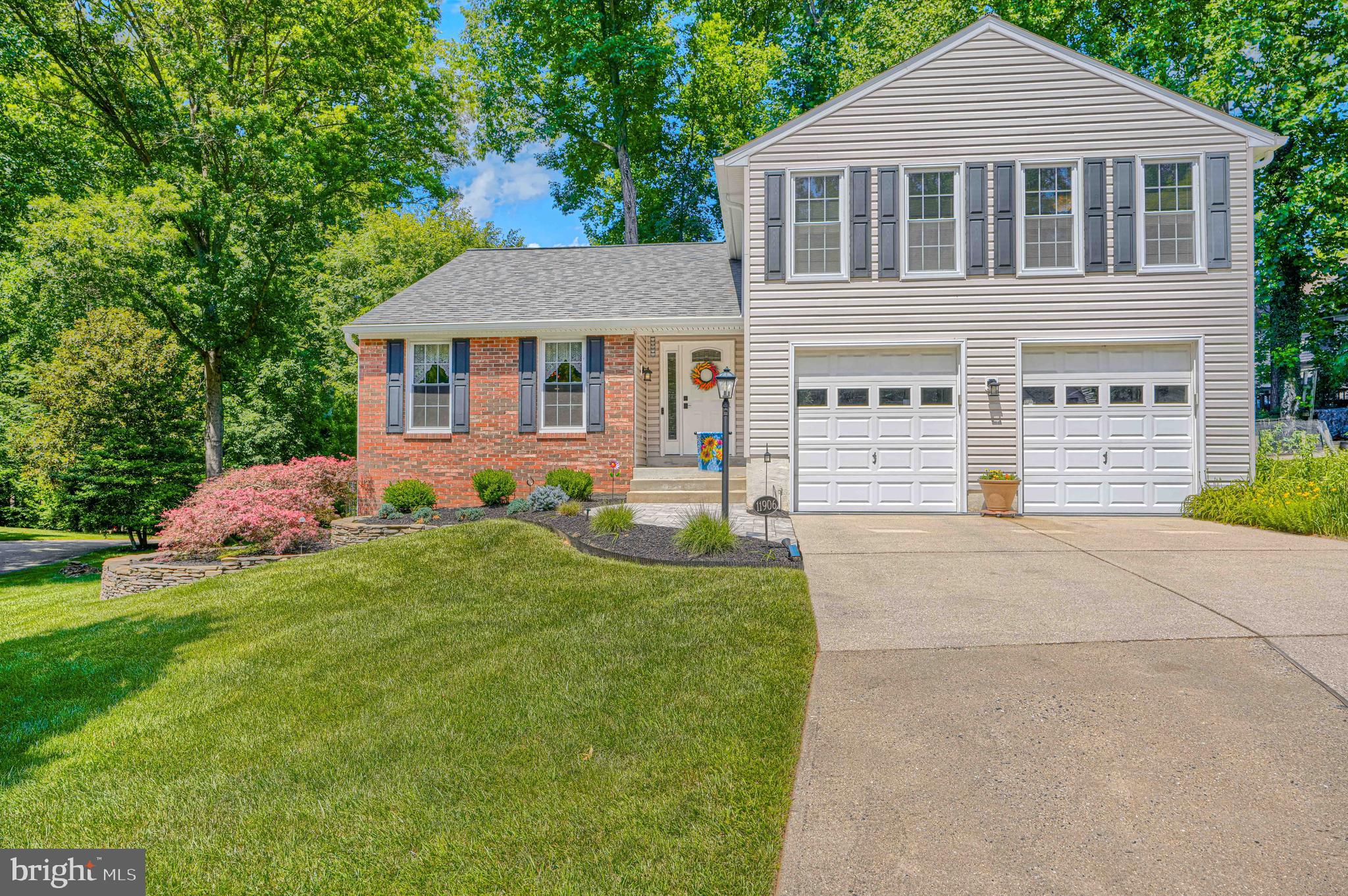 Welcome to this much loved, move-in ready, and beautifully updated home with newly refinished oak flooring (May 2026) thru both main levels. You'll enjoy many high-value renovations, especially the kitchen and bathrooms, along with significant mechanical & exterior updates!  The remodeled kitchen (2023) features a stylish combo of Birch lower and white upper cabinetry with self-close and deep pot drawers; Quartz counters & tiled backsplash; pantry w/pull-out shelving; large workstation sink w/drainer & cutting board; recessed & under-cabinet lighting; breakfast area w/slider opening to deck & custom-designed railing w/artistic inset; & SS G.E. Profile appliances including a smooth-top stove w/double oven that features steam cleaning and lower oven air fry capability * Family room w/slider opening to deck and brick floor-to-ceiling FP w/heatilator & brick hearth * Remodeled powder room w/modern vessel sink * Primary suite w/walk-in closet and remodeled en-suite bath featuring heated slate flooring, a large walk-in shower, beautiful tile, & skylight * 3 further BR’s w/replaced carpet (2022) share the remodeled hall BA (2019) w/a deep tub w/curved Kohler wall panel & shelving, vanity w/granite undermount sink, & LVT flooring * Exterior Upgrades: bi-level deck w/composite flooring, extensive hardscaping, slate patio outside of walk-out basement, paver front walkway, refreshed landscaping (2025), lovely plantings surrounding entire house, new vinyl siding & shutters (2015), new roof (2017), replaced tilt-in windows & sliding glass doors, replaced front door & sidelight (2022), & new 6" seamless gutters & 4" downspouts (2025) * Mechanical Upgrades: Trane HVAC (2010) w/app capable thermostat, 50 gal hot water heater (2015), app capable camera doorbell, radon remediation system w/replaced fan (2024), & programmable light bulbs w/app * All on a beautiful cul-de-sac lot in Clary's Forest near walking trails and the 1,000+ acre protected Middle Patuxent Environmental Area!