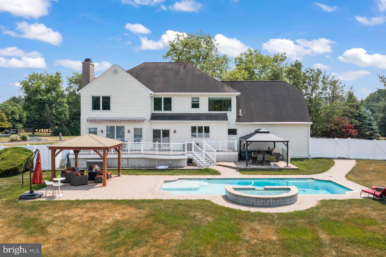 Welcome to 2 Wheatsheaf Ct., located in the desirable community of Canal Walk in New Hope, PA. This stunning home has recently been renovated and boasts an incredible backyard, making it ready for move-in. Situated on a cul-de-sac, it offers one of the best lots in the neighborhood.
Step inside and be captivated by the meticulously renovated kitchen, family room, mud room, and laundry area. The open floor concept has been thoughtfully designed with barn doors, new floors, cabinets, granite countertops, a large island, bar style sink, new appliances, a wine cooler, and a cozy fireplace. The electrical system has been upgraded, including a dedicated sub-panel. All windows have been recently replaced with top-quality Andersen energy-efficient Windows.
The staircase and general hallway hardwood floors have been refinished, adding to the home's charm. The main bathroom has been fully renovated, and a new one for the princess suite has been added. The existing hallway bathroom has been transformed into a Jack and Jill setup. Additionally, all bathrooms feature towel warmers for added comfort. The main bedroom now includes a repurposed room by Closets by Design, offering ample storage space with organizers.
For individualized comfort, each bedroom is equipped with independent Cool/Heated split units featuring dedicated thermostats and dual AC units. The main bedroom also features a backup heater. In 2015, the basement was upgraded to include a new office space, new carpet, and heating/cooling with a dedicated thermostat. The basement's functionality was enhanced with a custom workspace created by Closets by Design. Furthermore, the north basement wall features a French drain system with a new sump pump installed in 2022.
The home's essential systems have been well-maintained and updated, including a new Rheem high-capacity rapid recovery electric water heater in 2022, a new water pump in 2016, a new central HVAC compressor in 2017, and a whole-house generator installed in 2017. The water softener and septic pump have also been recently replaced. Additionally, the garage features a Level 2 electric vehicle charger and motorized doors, and new gutters adorn the lateral sides of the roof.
The backyard is a true oasis, perfect for creating cherished memories with loved ones. The impressive heated pool, reaching a depth of 8 feet, came complete with a hot tub featuring six jets and was expertly installed by Antony Sullivan in 2016. To ensure privacy, a new perimeter fence has been added. The outdoor living space includes a patio with two gazebos equipped with power outlets, ceiling fans, and retractable blinds or screens (installed in 2020).
For outdoor entertaining, the fully functional outdoor kitchen offers a sink with cold and hot water, a propane grill, an outdoor fridge, and cabinets with a granite countertop. The main deck was rebuilt in 2019 using low-maintenance composite materials. An added motorized awning with LED lights and lateral screens provides shade and protection from the sun, allowing you to enjoy the outdoors fully. For the boat afficionado the fence opens in both extremes to allow a sailboat or an RV to drive trough.
Don't miss the opportunity to see this extraordinary home and experience the unmatched lifestyle it offers.