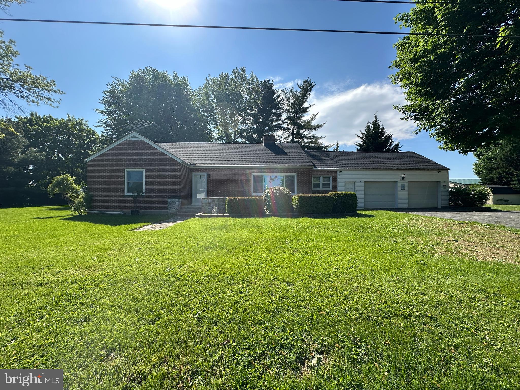 NICE 3-BEDROOM BRICK RANCHER IN THE GREENCASTLE SCHOOL DISTRICT! This inviting home offers 3 bedrooms and 1 full bathroom, along with a comfortable layout featuring a cozy family room with a beautiful stone fireplace, dining room, kitchen, laundry room, and an enclosed patio perfect for relaxing. The partial unfinished basement provides additional storage and functionality. The property offers plenty of storage space, including a 2-car attached garage and a 25x30 detached garage installed in 2022 featuring concrete floors, and electric! Recent updates include a new roof installed in 2025, new kitchen cabinets added in 2022, and new windows in the front of the home and in the bathroom, offering added value and peace of mind. Outside, enjoy a spacious yard along with an outdoor wood furnace that provides an alternative heat source. Don’t miss your opportunity to make this charming property your own! This property will be offered at auction on Thursday, June 4, 2026, at 3:00PM. The List price in no way represents a minimum, starting, or acceptable bid.