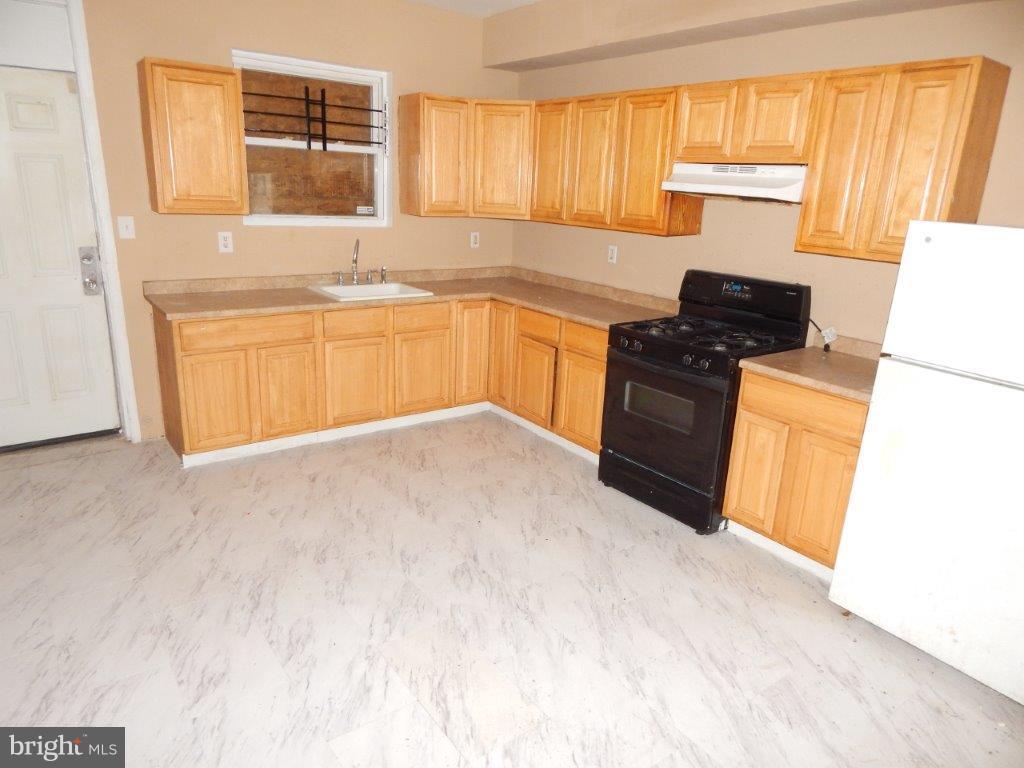 Excellent opportunity for an Investor to make this home their Cash-Cow Or a Great House for a first-time homeowner.  5BR 1.5 BA.  Huge eat-in Kitchen.  Lots of cabinet space.  Large open floor plan.  New carpets.  New & Updated electric.  Fresh paint.  Partially finished basement.  Close to shopping and transportation. Just blocks from Johns Hopkins Hospital.  Ask about  Seller help with closing costs.