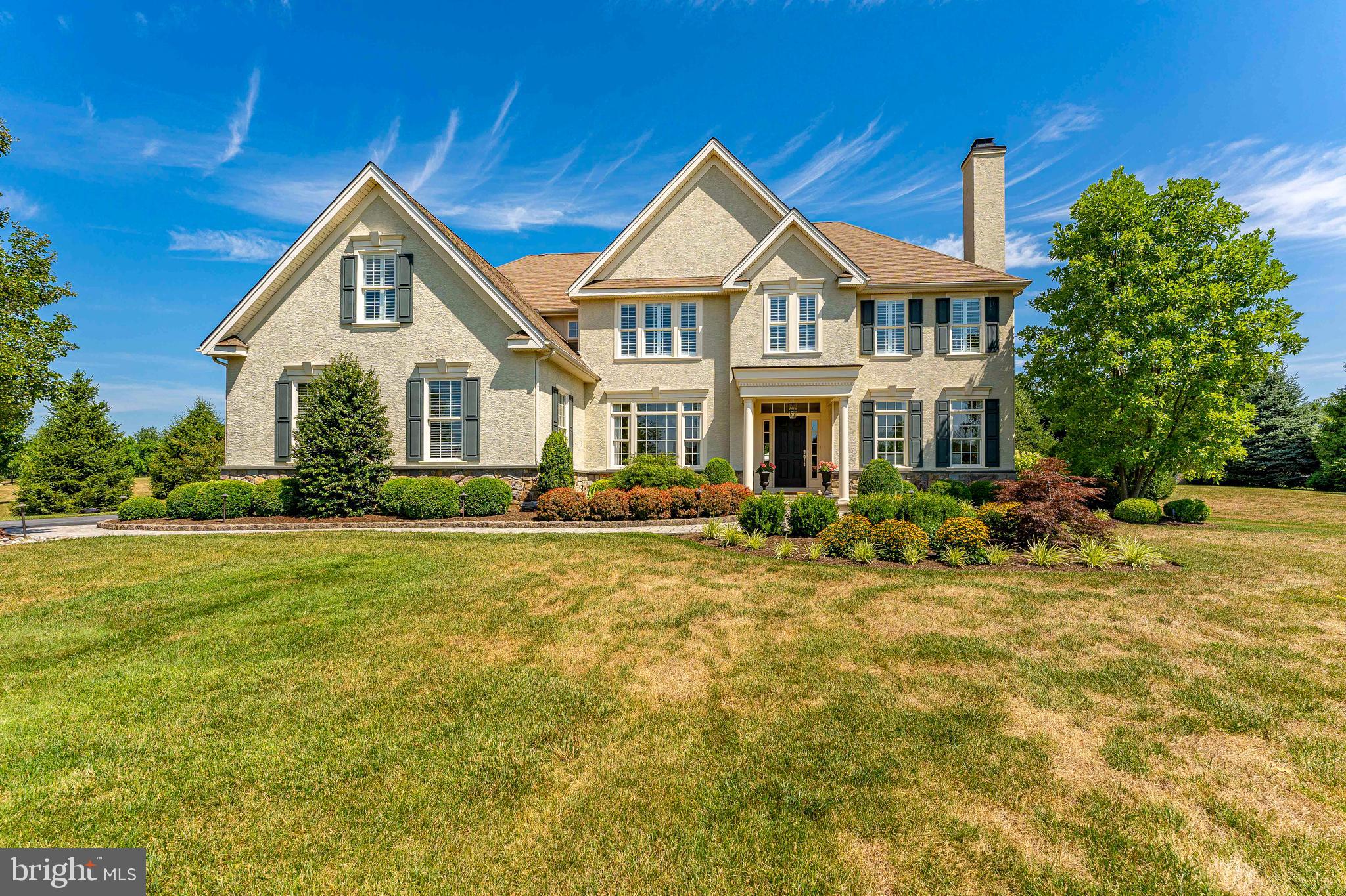 Welcome to 25 Cumberland Drive, a beautifully appointed 5-bedroom, 3 full bath, and 2 half bath home located in sought after Downingtown and the award winning Downingtown Area School District, this property offers luxurious living spaces, elegant finishes, and a backyard paradise perfect for entertaining. As you enter through the grand foyer, you'll be greeted by exquisite details including wainscoting, chair rail, crown molding, recessed lighting, a chandelier, a transom window above the door, and stunning hardwood floors that flow throughout the main level. To the right, the inviting living room features a cozy gas fireplace and is bathed in natural light from four large windows. French doors lead to a professional office, providing the perfect space for work or study. On the left, the formal dining room seamlessly connects to the gourmet kitchen, making entertaining a breeze. The kitchen boasts granite countertops, an island with a double sink, a tile backsplash, and a walk-in pantry. The adjoining breakfast room, with its tray ceiling, offers picturesque views and access to the patio and backyard. Step outside to your own private oasis. The backyard features a heated saltwater in-ground pool with three waterfalls, two patios, and a fully fenced yard surrounded by trees, ensuring privacy. Enjoy breathtaking sunsets over the serene "The Meadows" land behind the home, which cannot be built on. The spacious family room, highlighted by a floor-to-ceiling stone gas fireplace, is perfect for gatherings. The main level also includes two powder rooms and access to the 3-car garage. Ascend either of the two staircases to the upper level, where the primary bedroom awaits. This retreat features a tray ceiling, abundant windows, hardwood floors, and a hallway with two walk-in closets with custom cabinets. The remodeled spa-like en-suite bathroom offers a soaking tub, dual sinks, a rain shower with a hand spray, brass fixtures, porcelain tile floor, a linen closet, and a water closet. The second bedroom includes a walk-in closet and an en-suite bathroom with hallway access. The third and fourth bedrooms share a Jack-and-Jill bathroom with a tile floor, a linen closet, and double sinks. The fifth bedroom and a convenient laundry room complete this level. The walk-out basement, currently unfinished, provides ample storage space and the potential to add your personal touches. Additional features include plantation shutters throughout, a whole-house generator, and two new dual-zoned heaters. Don't miss this incredible opportunity to own a luxurious home in a prime location!