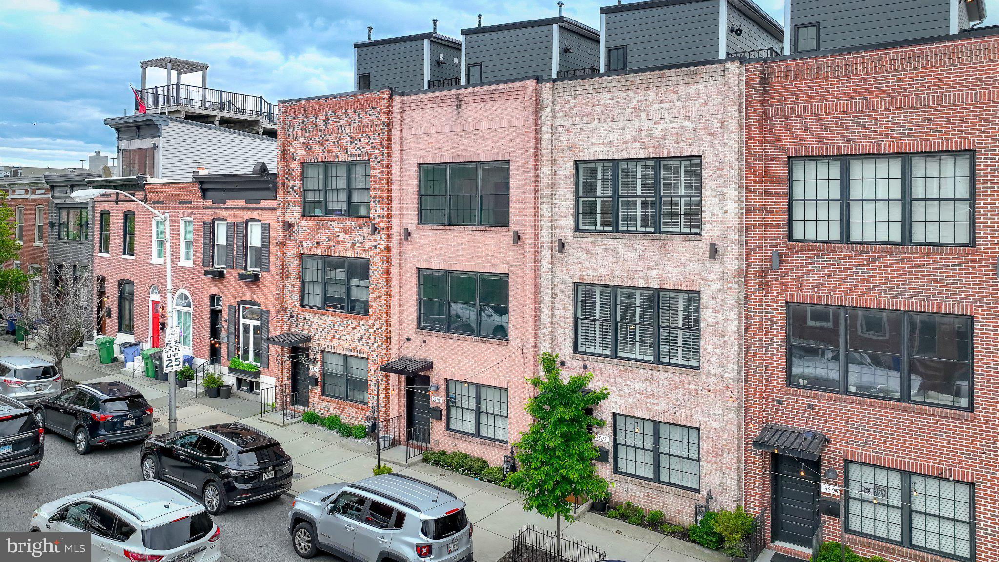 Welcome to 3509 O'Donnell Street — a stunning four-level luxury end-of-group townhome offering 3 bedrooms, 3 full baths, and 2 half baths, complete with a balcony, rooftop terrace, and an oversized 1.5-car garage plus an additional dedicated off-street parking spot.

The entry level welcomes you with an inviting foyer, convenient garage access, and a bedroom suite with ensuite bath — perfect for guests or a home office. On the second level, a spacious open floor plan is ideal for entertaining, featuring a bright living room, an elegant dining area, and a chef's kitchen anchored by an expansive island that seats four. Step directly off the kitchen onto the balcony — the perfect spot for your morning coffee.

The upper levels offer two generous bedroom suites, each with its own ensuite bath, plus a top-floor den complete with a wet bar and half bath. The den opens onto a rooftop terrace showcasing breathtaking views of the city and harbor — a fantastic place to entertain or unwind at the end of a busy day.

Experience the perfect blend of modern design, functionality, and city luxury, all in a premier Canton location just steps from O'Donnell Square, Patterson Park, the Waterfront Park and promenade, Canton Crossing, and more. Extremely accessible to I-95, I-895, and downtown, and zoned for Hampstead Hill Academy.

Schedule your showing today and fall in love with everything this home has to offer.