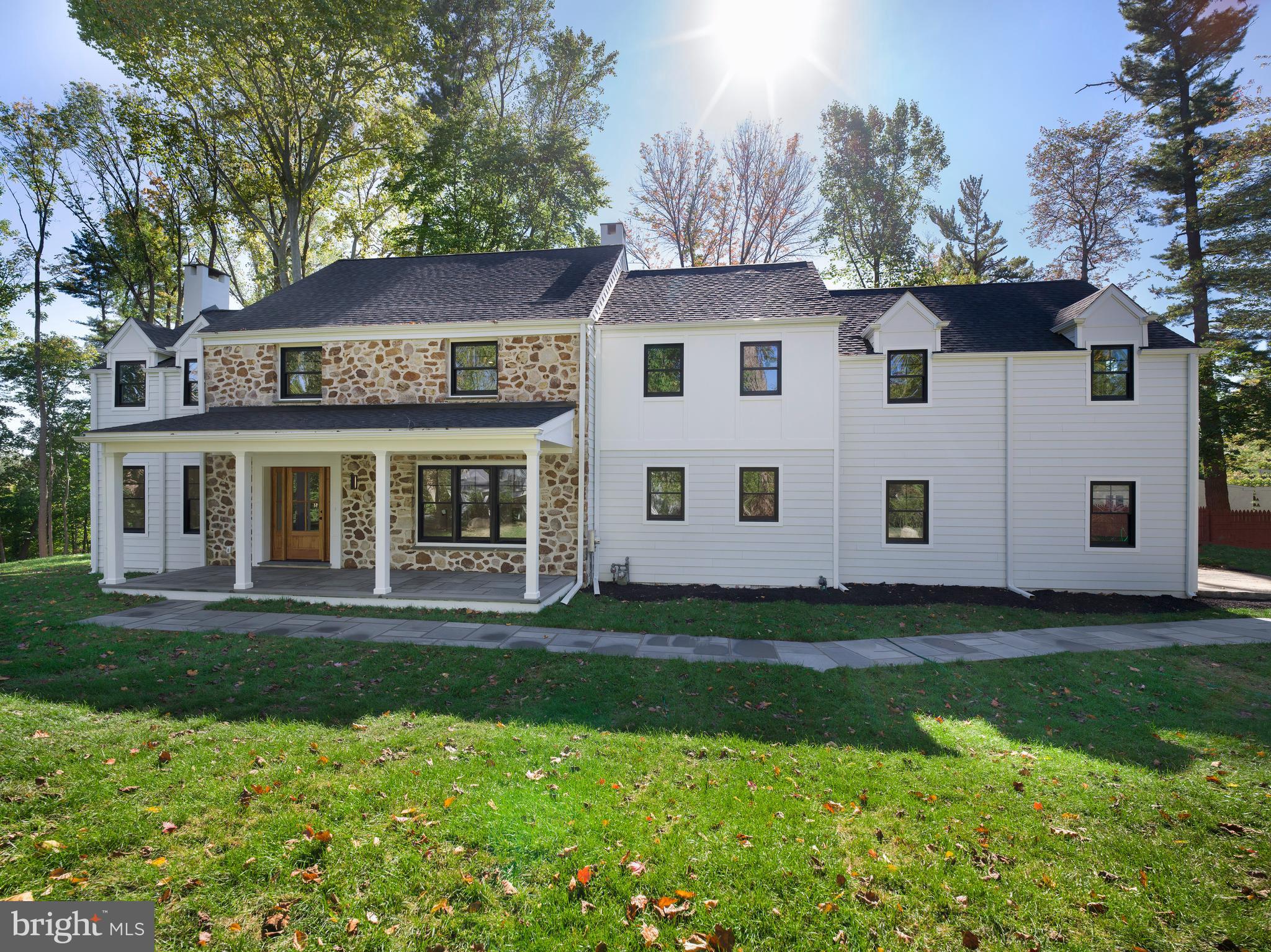 Welcome to 657 Lakeview Circle, a completely renovated home by well-respected BTR Construction, known for top-quality craftsmanship. Nestled on over an acre at the end of a highly desirable cul-de-sac in the award-winning Radnor School District, this home combines modern elegance with thoughtful design, offering incredible value. Every detail has been meticulously curated to reflect today’s aesthetic while ensuring timeless comfort throughout. The property offers all the features of new construction and comes with a custom builder warranty.
The private driveway leads to a 2-car garage, with a resident entry that includes custom-built lockers, closets, pantry storage and a convenient half bath. The main entry welcomes you with flagstone covered porch, closets for your guests and flows into a spacious living room with marble surround fireplace. The dining room is perfect for family gatherings or entertaining guests. Equipped with high-end appliances, the gourmet kitchen is appointed with a 48-inch Thermador range, microwave drawer, quartz countertops, and a marble backsplash and the all important SubZero refrigerator. It is open to the family room, which has a second fireplace and French doors that lead to another flagstone porch, offering expansive views of the serene rear yard. The first floor includes a bedroom suite with full bath, which could also function as a guest suite or home office. Wide-plank hardwood flooring runs throughout the first and second levels.
Upstairs, the primary bedroom suite has 2 walk-in closets and a luxurious spa-style bathroom with a soaking tub, dual vanities in warm wood tones, and classic Calcutta marble finishes. Bedroom
Suites 2 and 3 are filled with natural light and each has its own en-suite bath. Bedrooms 4 and 5 share a custom Jack & Jill bathroom, featuring a private shower area. All bedrooms are generous sized with spacious closets.  A full laundry room completes this level.
The finished lower level, with luxury waterproof vinyl flooring, offers expansive space perfect for entertaining or relaxing.
This home provides exceptional construction, generous & flexible living space, and a tranquil setting, all while being close to everything.