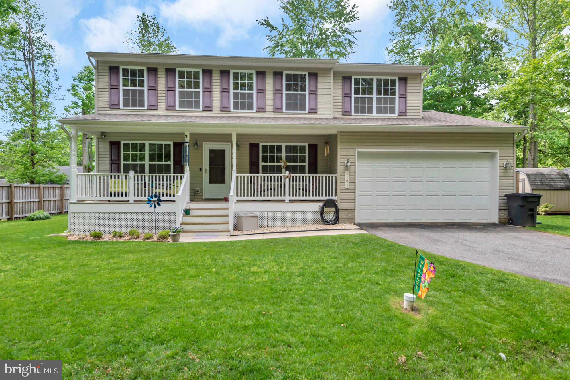 Welcome to Cedarhurst on the Bay!  Water Provilege Community Within Walking Distance to Community Marina with Slips, Beach, Playground, Boat Ramp along Chesapeake Bay.  Gorgeous Colonial with Open Floorplan.  Home has Front Porch for your Relaxation, which you have  a Wooded Lot Across from it.  Large Fenced in Backyard with Deck.  Updated Kitchen with Quartz Countertops, Backsplash, Deep Sink with Laminate Floors.  Main Level Boasts Wood Plank Floors Throughout.  Family Room with Gas Fireplace.  Upper Level with Primary Suite, Primary Bath with Soaking Tub, Double Sinks, and Separate Shower.   Laundry on Bedroom Level.  Home is Hardwired for Generator.  Spacious Two Car Garage.  Must See to Appreciate!
