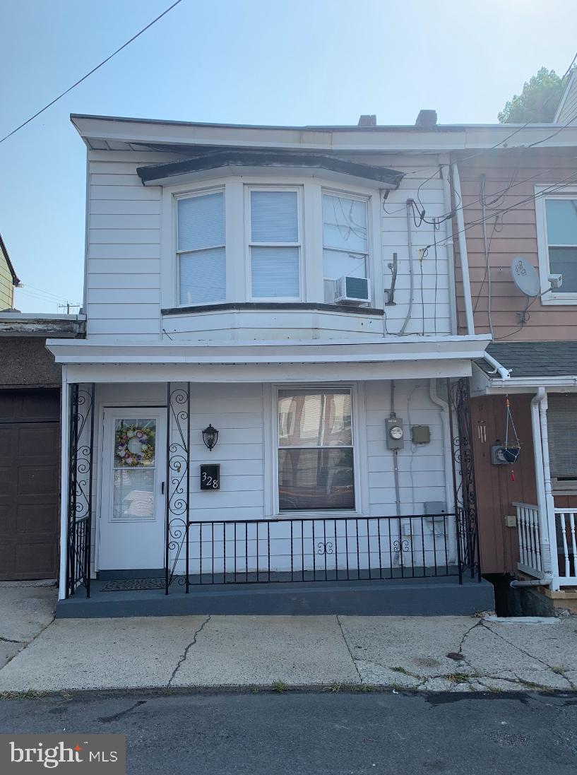 Back on the market due to buyer financing.  Freshly updated and ready to move in.  Living room /dining combination with plenty of living space.  Kitchen has newer cabinets and back splash with convenient washer dryer right there.  There is also a half bath on the first floor.  Second floor has 3 private bedrooms .  The front bedroom has plenty of natural light and a large closet with built in shelves on both sides.  Bathroom has tub and shower with new vanity.   The attic is finished with heat and can be used as a possible 4th bedroom.   There is a covered porch and nice size yard for plenty of outdoor entertaining.  Most windows have been replaced.  Appliances are included.   200 amp service added in 2022.  Just down the street from the Laurel and 12th St bus stop.  come back this your new home for 2024.