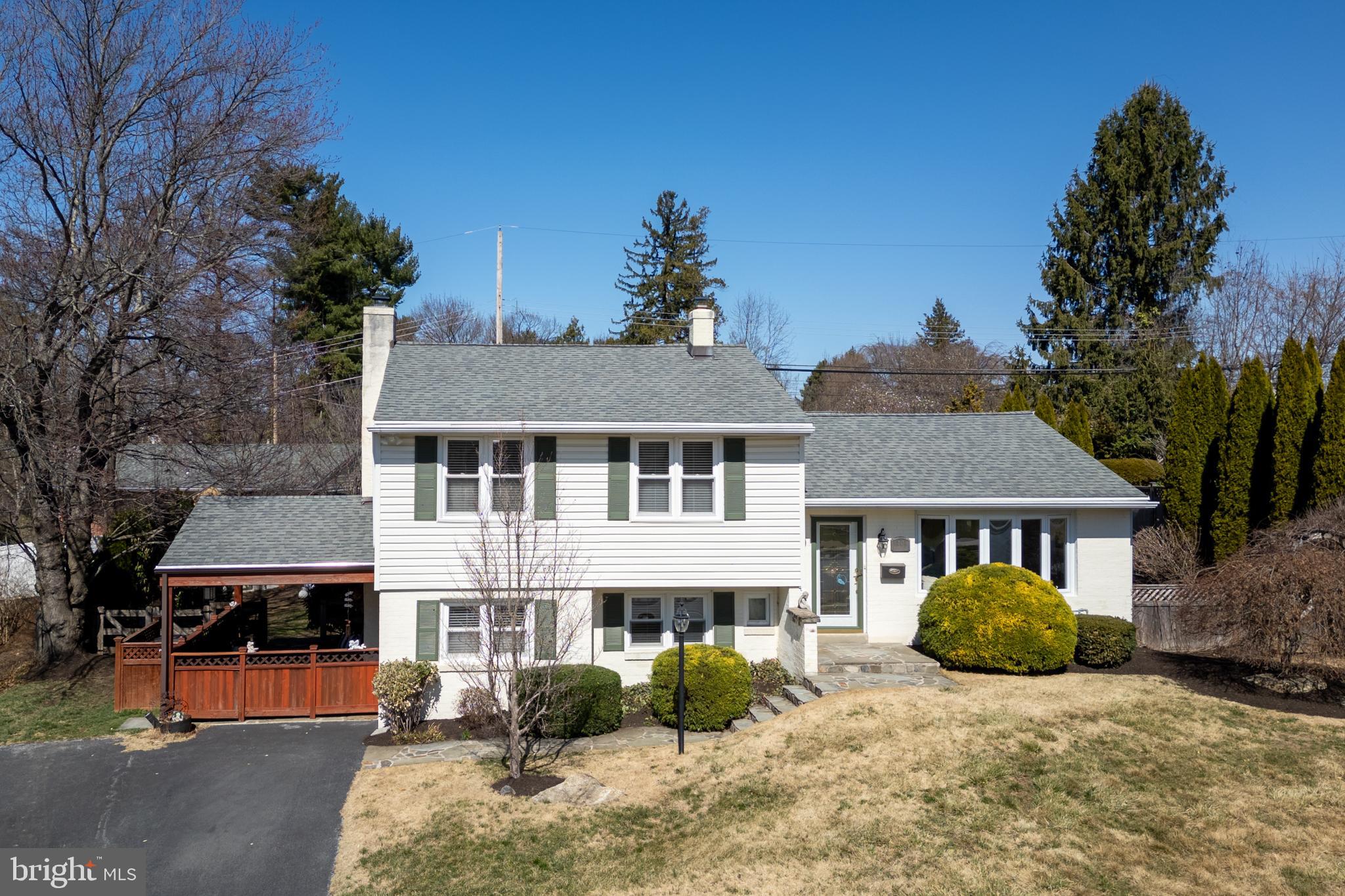 This remarkably spacious split-level Colonial is beautifully designed indoors and out! South facing and bathed in sunlight, you’ll enjoy a covered side patio with a ceiling fan, as well as a backyard with a flagstone patio, and an electric fence around the entire yard. Beautifully landscaped with spring-blooming shrubs and evergreens for privacy, you’ll have your pick of outdoor spaces for entertaining or relaxation. Inside, this charming home offers open concept living, dining and kitchen as well as a convenient laundry/mud room on the main level. A living room bay window takes full advantage of that beautiful natural light. Step down a half level to the den with a floor to ceiling brick fireplace with wood mantel. An absolutely enticing space with a convenient powder room. Upstairs, there are 3 generously sized bedrooms, all with hardwood floors, and there’s a stylishly updated full bathroom. 313 Mayfield Ave also offers off-street driveway parking, an unfinished basement, and you’ll be within 5 blocks of the West Chester Borough library. It’s a 10-minute stroll to Hoopes Park with a baseball field and tennis courts, and you’ll have the Borough’s shops and restaurants at your fingertips. Request a personal tour today!