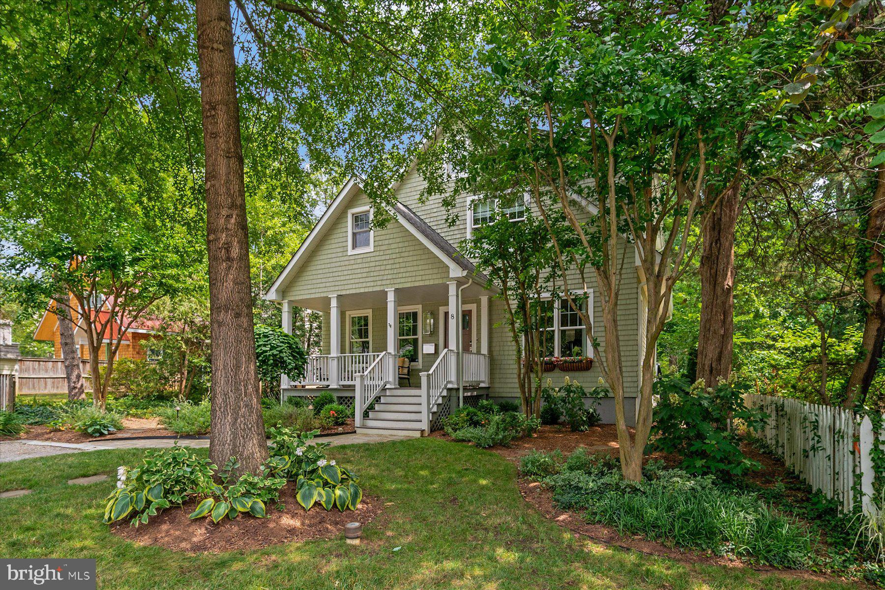 Originally built in 2005 and renovated with high end materials, this exceptional Craftsman-style home offers over 3,500 square feet of beautifully finished living space and has been meticulously maintained and thoughtfully updated throughout. The open-concept floor plan offers the perfect balance of comfortable everyday living and effortless entertaining, featuring abundant natural light, crown molding, recessed lighting, and seamless flow between the main living spaces. At the heart of the home is the newly renovated kitchen, complete with a large island with Quartz countertops and seating for up to eight, custom wood-paneled refrigerator and freezer, Signature custom cabinetry, and premium Wolf and Monogram appliances. The adjoining family room features custom built-in bookcases, a Montigo gas fireplace, Sonance in-wall speaker system, and direct access to the screened porch, creating an inviting space for gathering year-round. Additional highlights include a custom wet bar, a main-level bedroom and full bath, and a finished lower level offering flexible space for recreation, guests, or a home office. Outside, the fully fenced, level backyard is a private retreat with mature trees, a spacious patio with a Caldera hot tub, and a built-in outdoor fireplace making it perfect for entertaining in every season. Ideally located in the heart of West Annapolis, this home is just a few blocks from local restaurants, shops, and the community boat ramp. With easy access to Route 50, commuting is simple and convenient. Offering timeless style, premium updates, and thoughtful design, this home is a rare opportunity in one of Annapolis' most desirable neighborhoods.