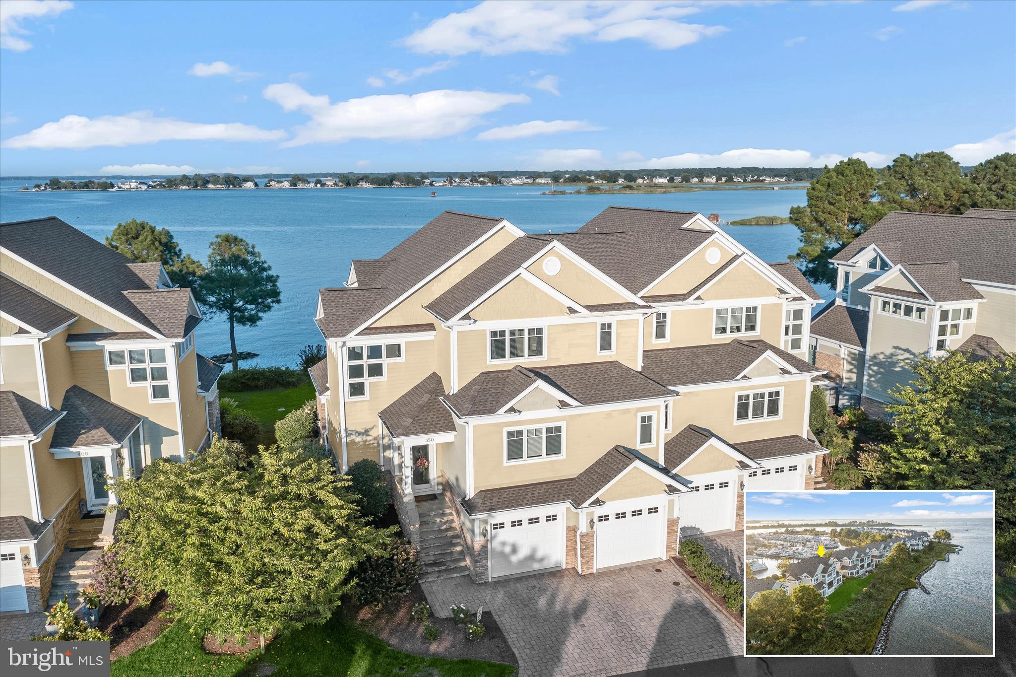 Perfectly positioned along the living shoreline of the Chester River, this waterfront residence in the gated community of Narrows Pointe offers breathtaking, million-dollar water views and a lifestyle centered around the beauty of the Eastern Shore. 
One of the few wide units in the community, the home is thoughtfully designed to maximize its remarkable setting. Three-panel sliding glass doors invite in abundant natural light while framing sweeping water views, and decks on two levels with retractable electric screens create inviting spaces to relax while overlooking the shoreline. A spectacular arrangement of windows throughout the home continually draws your eye to the tranquil river setting.
Inside, hardwood flooring, recessed lighting, and a neutral color palette welcome you upon entry. The gourmet kitchen serves as the heart of the home and features granite countertops, a center island with breakfast bar, tile backsplash, wine refrigerator, and 42-inch cabinetry with under-mount lighting and convenient roll-out drawers for easy organization. High-end stainless steel appliances complete the space, and the adjacent dining room provides a bright setting for everyday meals or entertaining. Just off the kitchen, a walk-in pantry and laundry room add everyday convenience and extra storage.
Also on the kitchen level is a bedroom suite currently used as an office, enhanced with built-ins that create a comfortable workspace while still offering flexible guest accommodations.
The living room showcases a dramatic angled ceiling, a striking stone fireplace, and custom built-ins, creating a warm gathering space while keeping the focus on the surrounding water views.
Upstairs, generously sized bedrooms each include en-suite baths with granite-topped vanities. The primary suite offers a peaceful retreat with a walk-in closet featuring built-in organization, a private deck overlooking the river, and a luxurious bath with remote blinds, double vanity, jetted self-cleaning tub, and Toto toilet. Both of the upper-level bedrooms were enhanced with updated hardwood flooring in 2020.
The lower-level recreation room adds another versatile living area with a custom bar and cabinetry, making it an ideal space for entertaining. The finished garage features a granite flake floor and storage cabinetry, and the home also includes a whole-house speaker system. Architectural plans are available for the future addition of an elevator.
Recent improvements include whole-house interior painting completed in 2020, replacement of the living room sliding glass door, updated electric screens, a 75-gallon water heater, built-ins throughout, professional installation of a TV mount above the fireplace, finished garage upgrades, carpeting and stair runner, water softener, and more.
Located near the heart of Kent Narrows, the home offers easy access to a casual waterfront lifestyle with marinas, boating activities, community piers, a kayak launch, and a variety of waterfront restaurants and tiki bars. The Cross Island Trail begins just outside the Narrows Pointe entrance, while shops, hotels, and multiple fitness centers, some with pools, are all within a convenient 10-minute drive. Nearby outdoor destinations such as the local dog park and Terrapin Nature Park add even more ways to enjoy the natural beauty of Maryland’s Eastern Shore.