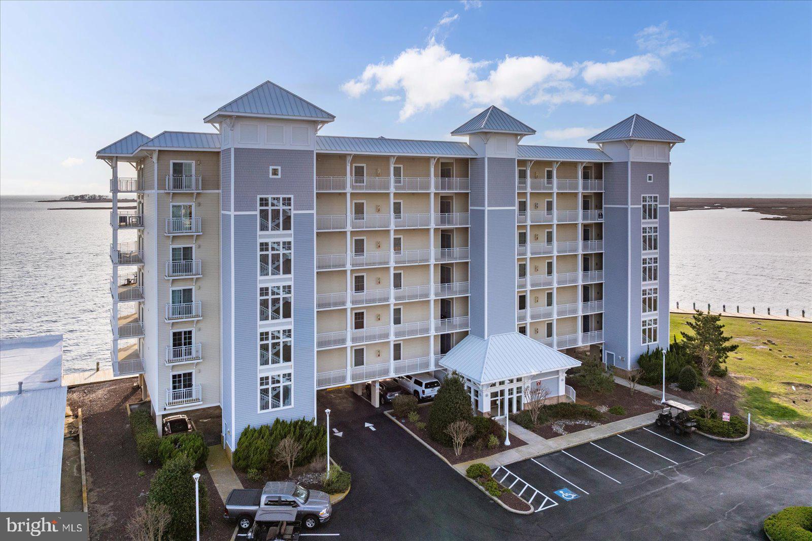 This condominium in the upscale Harbour Lights community offers what is possibly the most premium waterfront location in Somerset County! Top floor, corner unit has spectacular unobstructed  nearly 360 degree panoramic views of the Tangier Sound, Annamessex River, Crisfield City Dock and beyond to the Bay! Witness "life on the bay" with the passage of both recreational and commercial boat traffic passing before your eyes! Wraparound deck provides views and screened porch space to the west(for our truly spectacular sunsets) , north and east! Kitchen has all upgraded black stainless appliances, granite countertops, tile flooring. Dining area and living room have wood flooring. Laundry has upgraded appliances. Primary suite has direct access to the screened porch and a large primary bath with jetted tub and shower, and walk in closet.  Two additional bedrooms have a hall bath conveniently located nearby. The well maintained pool is a bonus, and there are boat slips available in the Harbour Lights marina. A short drive will take you to Janes Island State Park, renowned for waterfront camping facilities and a natural protected environment. Enjoy nature kayaking and bird watching in a peaceful surrounding. Nearby is the Crisfield Airport for aviators. Family friendly Crisfield has festivals and activities all summer long. If you want to visit Smith or Tangier Islands, the ferry boats are located just at the City Dock, or take your own boat 12 miles to experience island life.  Harbour Lights has security access to both the lobby and the pool area.  All furnishings can be purchased at a reasonable cost.