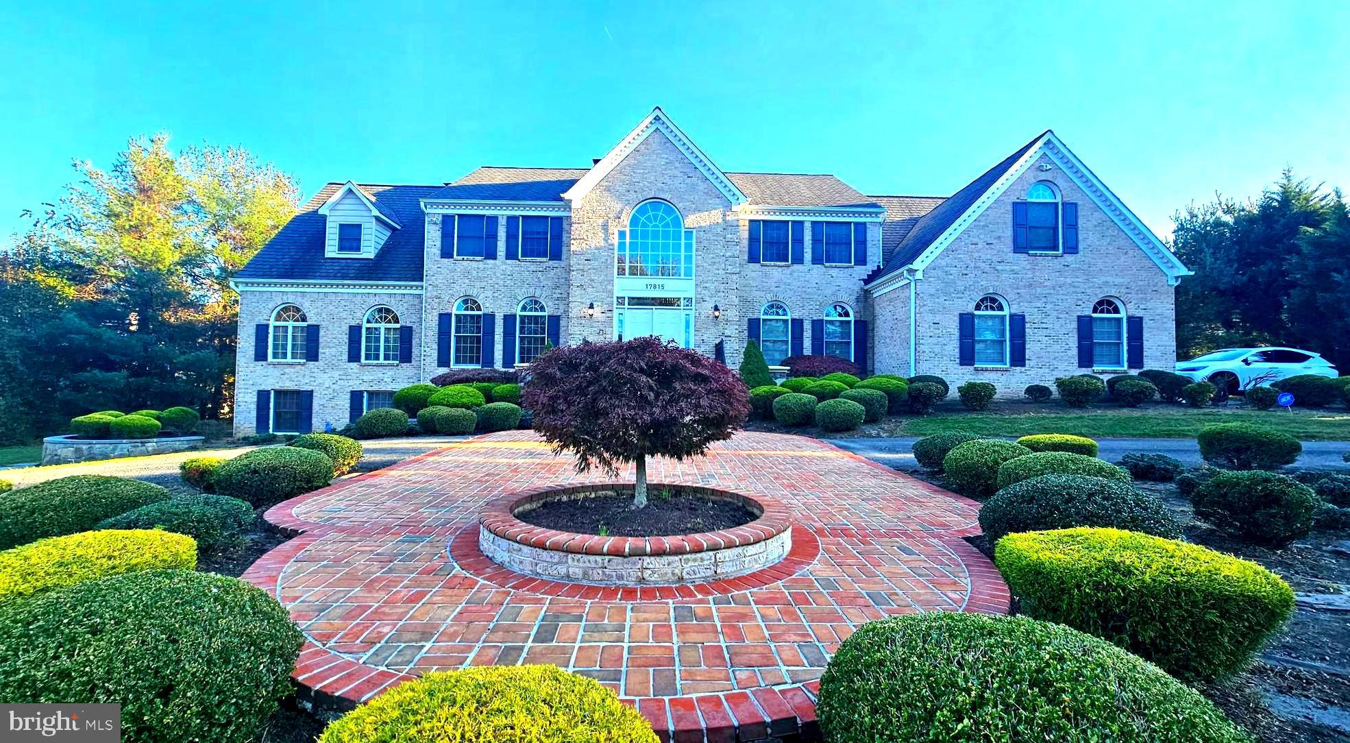 Amazing custom-built over 8,000 sq ft brick Colonial with 5 bedrooms, 4.5 baths and 3 car garage on a 1.8-acre lot. Countless upgrades throughout. Gourmet Kitchen with Viking professional appliances and large Breakfast Room; Great Room featuring stunning stone fireplace; Banquet Dining Room with extensive architectural molding; Huge Living/Social Gathering with expansive views and French door access to deck and flagstone patio; Home Office on main level; Generous Master Suite includes a Sitting Area with wood burning fireplace, luxury en suite with huge walk-in closet and Electrolux washer & dryer laundry space with storage; Open concept expansive lower level has fully equipped kitchen, two additional bedrooms, full bath and Recreation room with wood burning fireplace ---All this on a quiet street close to ICC MD 200, Shady Grove MetroRail Redline, Rock Creek Park, Lake Needwood Boating, Olney shopping and more.----------------Grand 2 story reception foyer with double door entryway and side lights welcomes you with marble flooring, decorative shadow boxes, chair rail and crown molding. Two conveniently located coat closets and architectural arches throughout main level add to the charm. Living room continues detailed millwork with chair rail and crown molding and ceiling medallion. Banquet sized Dining Room has ceiling medallion and extensive architectural moldings. Huge Living Room/Social Gathering boasts a wood burning fireplace and 2 sets of French doors leading to rear yard.3rd set of French doors opens to the well appointed Home office. Gourmet Kitchen has large center island with granite countertops, all Viking professional appliances large double-door refrigerator, 6 burner gas cooktop in island, 2 dishwashers, beverage refrigerator, double oven and microwave -- double sink, and attractive ceramic tile backsplash. Breakfast area and separate breakfast room boast a wall of windows, 5 skylights, and French doors to the Trex screened in porch with eye-catching tray ceiling accented with glass block windows, recessed lights and large ceiling fan. Great Room off kitchen is highlighted by the impressive raised slate hearth floor-to-ceiling stone fireplace, with decorative molding, vaulted ceiling, wet bar area with wine glass storage & granite countertops, Palladium windows, and large storage area completing the room. Light and bright Family Room on opposite side of kitchen has 8 skylights (2 w/remote openers), custom built-ins for TV/sound system/storage, and sliding French door leading to the screened in porch, deck and large flagstone two-level patio. Convenient Butler s Pantry area offers an abundance of storage and desk area. Adjacent Mud Room includes a utility tub and additional coat closet and offers access to the 3-car garage with upgraded modular flooring. Upstairs landing affords a dramatic overlook into Great Room below. Master Bedroom has columns & arches, recessed lighting, architectural molding and Sitting Area with attractive marble wood burning fireplace hearth & surround. Luxury suite Bath has French door entry, marble counters, dual vanities sinks, separate shower, window seat, circular soaking Jacuzzi tub, dual linen closets, two walk-in closets -- 1 large with built-ins & attic access, and 1 with Electrolux W/D & storage. Separate water closet contains a bidet, toilet & sink. Bedroom 2 is a junior suite with vanity, ceramic tile and tub. Hall includes ample storage with dual linen closets. Bedroom 3 connects to the Jack & Jill bath. Spacious Au Pair suite includes a separate bedroom with 2 closets, entrance to the Jack & Jill bathroom, and expansive living area with Palladian window and back stair access to main level.
