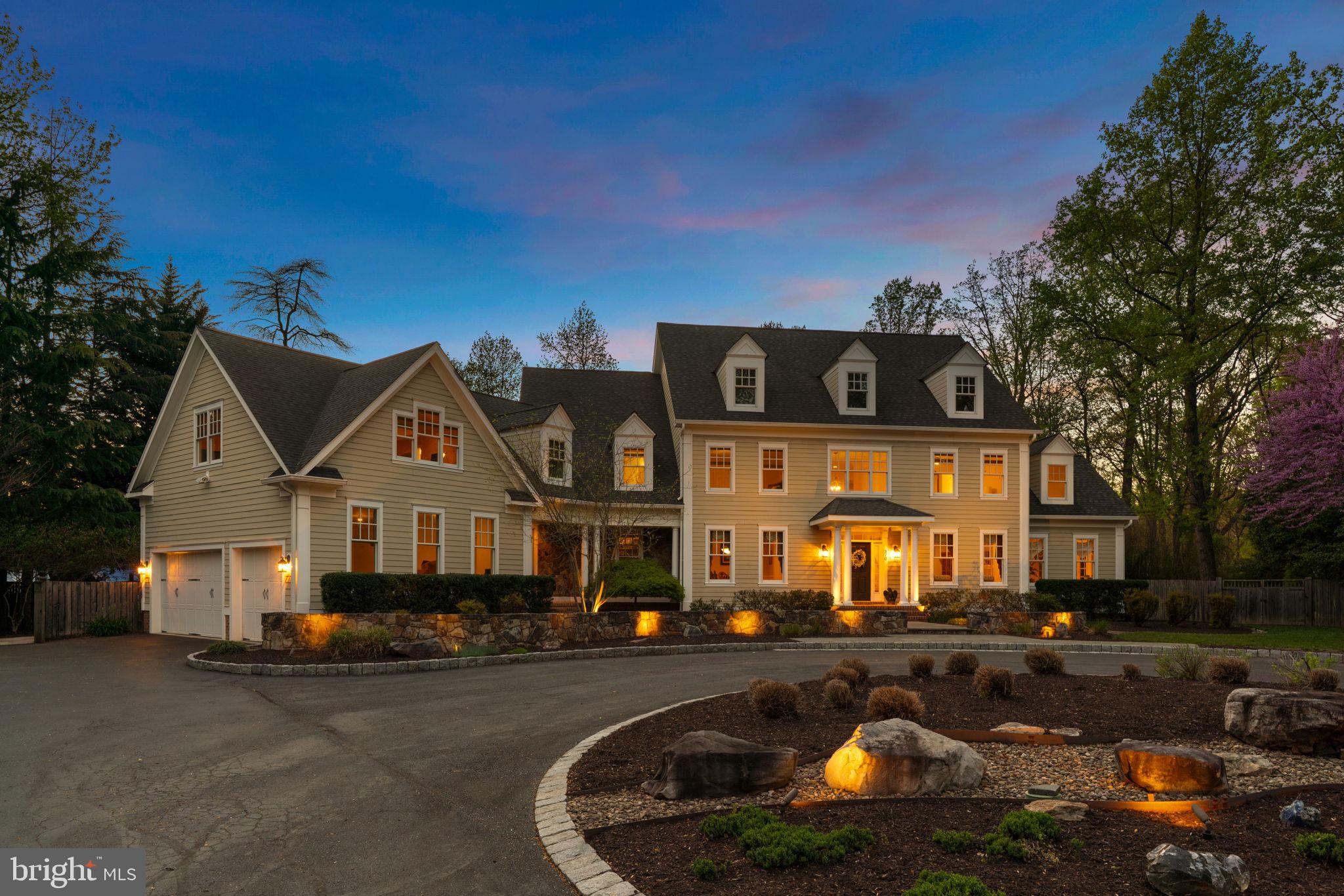 An Exceptional Offering...Where Privacy, Scale, & Waterfront Luxury Converge // Refined living space unfolds throughout this remarkable residence, seamlessly blending timeless architecture with high-end finishes and thoughtfully-curated interiors. Rich hardwood floors extend throughout, while multiple fireplaces and extensive millwork—including crown molding, wainscoting, and stately architectural columns—add warmth, depth, and sophistication at every turn. A dramatic two-story foyer introduces the interior with an elegant turned oak staircase flanked by formal living and dining rooms. The dining room is gracefully defined by columns, while the living room showcases French doors that open into a breathtaking conservatory with grand Palladian windows, vaulted ceilings, upper windows, a gas fireplace, and direct access to the outdoors. // The impressive open-concept great room is designed for entertaining and everyday luxury. The family room makes a striking statement with a brick-accented wood-burning fireplace, a custom built-in media center with bookcases and cabinetry, and refined columned details. The gourmet chef’s kitchen is equally exceptional, appointed with top-of-the-line Sub-Zero® & Wolf® appliances, granite counters, a large island with seating, custom cabinetry, chic backsplash, and a peninsula breakfast bar that flows effortlessly into the sunlit breakfast room with panoramic windows and exterior access. A well-appointed butler’s pantry with a beverage refrigerator and built-in wine storage enhances functionality. The main level also offers a private bedroom suite with French doors, built-ins, a closet, and an attached full bathroom—ideal for guests or multigenerational living. A powder room and a laundry room complete this level. // Upstairs, the luxurious primary suite features a tray ceiling, a sitting room with gas fireplace and panoramic water views, multiple closets, and a spa-inspired bathroom with separate vanities, a frameless glass-enclosed shower, a corner Jacuzzi® tub, and heated floors. Three additional generously sized bedrooms on this level each include their own private bathrooms—one offering dual closets, including a hidden walk-in. // The walk-up lower level is designed for versatility and indulgence, in a spacious recreation room with custom built-ins, a stone-accented fireplace, a wet bar and kitchenette, and a temperature-controlled wine cellar with capacity for 500 bottles. A game area, gym or bonus room, full bathroom, and storage area complete this level. // Outdoors, the property embodies a true resort. A deck with a partial pergola and a fully equipped Lynx® outdoor kitchen overlooks expansive paver patios surrounding a lagoon-style saltwater pool with cascading waterfall and built-in heated spa. A screened gazebo is complete with electric screens and a stone fireplace, while lush, tropical-inspired landscaping enhances the sense of escape. Extending beyond, enjoy your private pier along Blackhole Creek affords you the ease and convenience of an unparalleled waterfront lifestyle.
