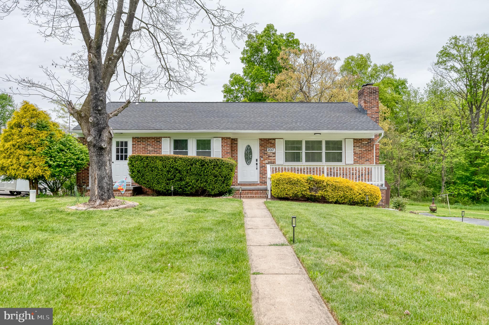 PRICE IMPROVEMENT! Welcome home to this charming all-brick rancher / beautifully renovated with a bright, open-concept floor plan connecting the living room, dining area, and kitchen for effortless everyday living and entertaining. This light-filled home features LVP flooring throughout and a stylish modern kitchen with elegant finishes to include quartz countertops, stainless appliances, upgraded cabinets, a pantry, tile flooring and a breakfast bar. This home has three full bathrooms... all thoughtfully updated with a sleek, contemporary design. Primary bedroom with private bath, two additional bedrooms and hall bath complete the main level. The finished lower level offers additional living space with a spacious rec room, private bedroom, and full bath—perfect for guests, extended family, or a home office. Enjoy the expansive, flat backyard ideal for outdoor activities, gardening, or relaxing, plus the convenience of a one-car side-entry garage. Move-in ready with modern updates and timeless charm!