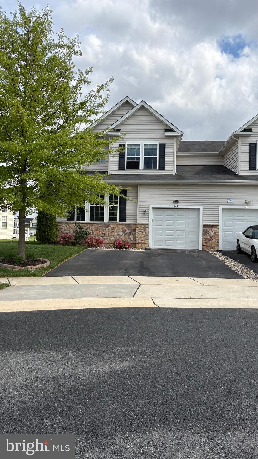 Welcome to 409 Galway Court in the Popular Community of Hyetts Crossing. Conveniently located with quick access to Rt's 1 & 301.  This Home is the Spacious Chesterfield Model Carriage House with a Main Level Owners Suite.  Designed for Open Concept Living the Main Level has a Great Room with a Break Away Ceiling (2 Story High) with 2 Walls of Windows allowing in ample sunlight. There is a Gourmet Kitchen with Enamel White Cabinets,  Large Center Island, Granite Counter Tops, Tile Backsplash, 2 Wall Ovens, B/I Micro Wave Oven & a Side-by-Side Refrigerator.  All Appliances are Stainless Steel.  There is also a Dining Room just offer the Kitchen.  A conveniently located center hall just off the Entry Area leads to the 2nd Floor Turned Staircase,  Access Door to the Garage, the Laundry Closet & The Owner's Suite which is spacious with a picture window and a Walk-in Closet. The Full Bath has a Double Sink with ample storage in the Vanity and Glass Enclosed Tile Shower with seat. The Main Level and Upper Level have recently installed LVP  Flooring, Neutral Stain. There is also has a Powder Room on this level. The Upper Level has a Loft Area perfect for a Home Office, Exercise Area or TV Room. There are 2 Guess Bedrooms. The Front Bedroom has its own Full Bath and Walk-in Closet. There is also a 3rd Full Bath and a 2nd Bedroom just off the Loft. The Lower Level is a Full Basement with Poured Foundation/Insulated & a Egress Window. Perfect Area for future living space. There is a Deck just off the Kitchen that over looks Fenced rear yard.