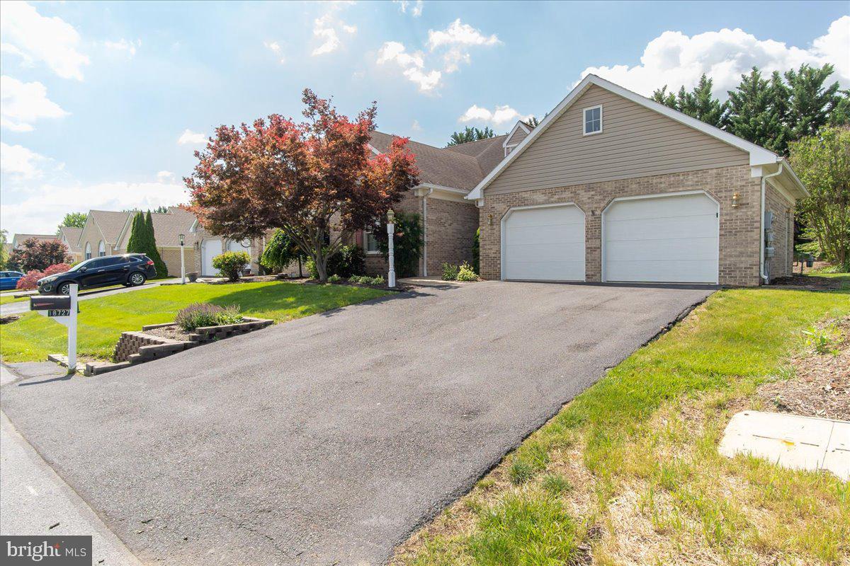 Spacious, convenient, and exceptionally well-maintained semi-attached home in Arborgate offering 2,128 sq. ft. of comfortable living space. Enhanced with an attractive brick exterior and a welcoming brick-paved walkway leading to the front entrance, this home offers timeless curb appeal and low-maintenance living in one of the area's most desirable communities.
The main level features a primary suite with a full bath, shower, large walk-in closet, and convenient laundry area. A second bedroom and full bath with tub/shower provide flexibility for guests or family. The spacious living room is highlighted by soaring vaulted ceilings, a cozy gas fireplace, and patio doors leading to the sunroom, creating an open and airy feel throughout the main living area.
The light-filled sunroom provides valuable bonus living space that can be used as a sitting room, reading area, entertaining room, or simply the perfect place for all your plants to thrive. Surrounded by windows and filled with natural light, it's the ideal spot to enjoy your morning coffee, unwind at the end of the day, or gather with friends for a relaxing evening in.
The eat-in kitchen offers white cabinetry, tile flooring, white appliances, and plenty of space for casual dining. Conveniently located just steps from the oversized two-car garage, bringing in groceries and everyday items is a breeze. A versatile room just off the kitchen provides the perfect space for a home office, den, craft room, or reading nook.
The open-concept living and dining areas provide plenty of room for entertaining and everyday living. Upstairs, you'll find a spacious loft overlooking the living room below, along with a third bedroom, full bath, walk-in closet, and additional storage space.
The oversized two-car garage offers ample room for vehicles, storage, or a workshop and includes pull-down attic access and crawl space access. Outside, enjoy a garden area perfect for flowers, herbs, or vegetables.
The Arborgate HOA is just $60 per month and covers lawn mowing, snow removal for accumulations over 4 inches, and driveway clearing, allowing you more time to enjoy a carefree lifestyle.
Ideally located close to shopping, dining, entertainment, healthcare, and major commuter routes, this home offers the perfect balance of convenience and tranquility. Enjoy easy access to everything you need while still experiencing the beauty and relaxed pace that make Western Maryland such a desirable place to call home.