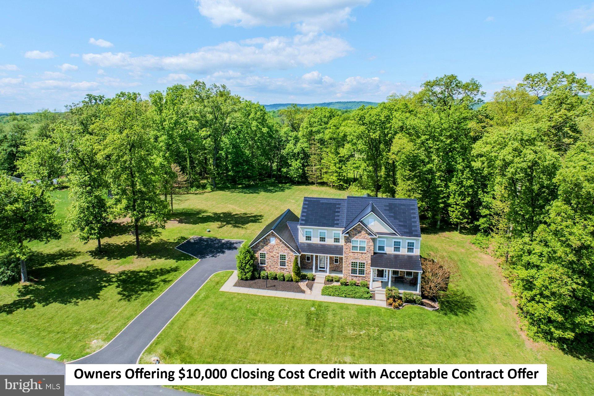 Owners offering $10,000 closing cost credit with acceptable contract offer! Welcome home to this stunning colonial peacefully situated on a 1.71 acre lot with over 5,300 square feet of living space & a Tesla solar roof system that was installed in 2025. This premium solar roof system has a Powerwall battery back up supply to provide power during power outages! The covered front porch greets you as you enter into the front foyer. Spacious living room, formal dining room & privately tucked place library on the main level ideal for working from home. Grand two story family room with stone surround gas fireplace & tons of light. Expansive gourmet kitchen with center island, stainless steel appliances, upgraded backsplash & morning room extension with access to rear yard for future outdoor space. Main level mudroom with additional exit to the outside & half bath too. Large primary suite with coffered ceiling, walk-in closet & luxurious bath with soaking tub & separate shower. The second bedroom features private bath. Third & fourth bedrooms share a spacious third bath. Walk-up lower level with recreation room with new carpet in 2025, 5th bedroom/den, fourth full bath, den/craft room & storage room. Oversized three car garage with car charger & expanded driveway allowing for additional parking.  This home is peacefully located on a paved cul-de-sac street with a large rear yard providing ample open space as well as trees providing privacy.