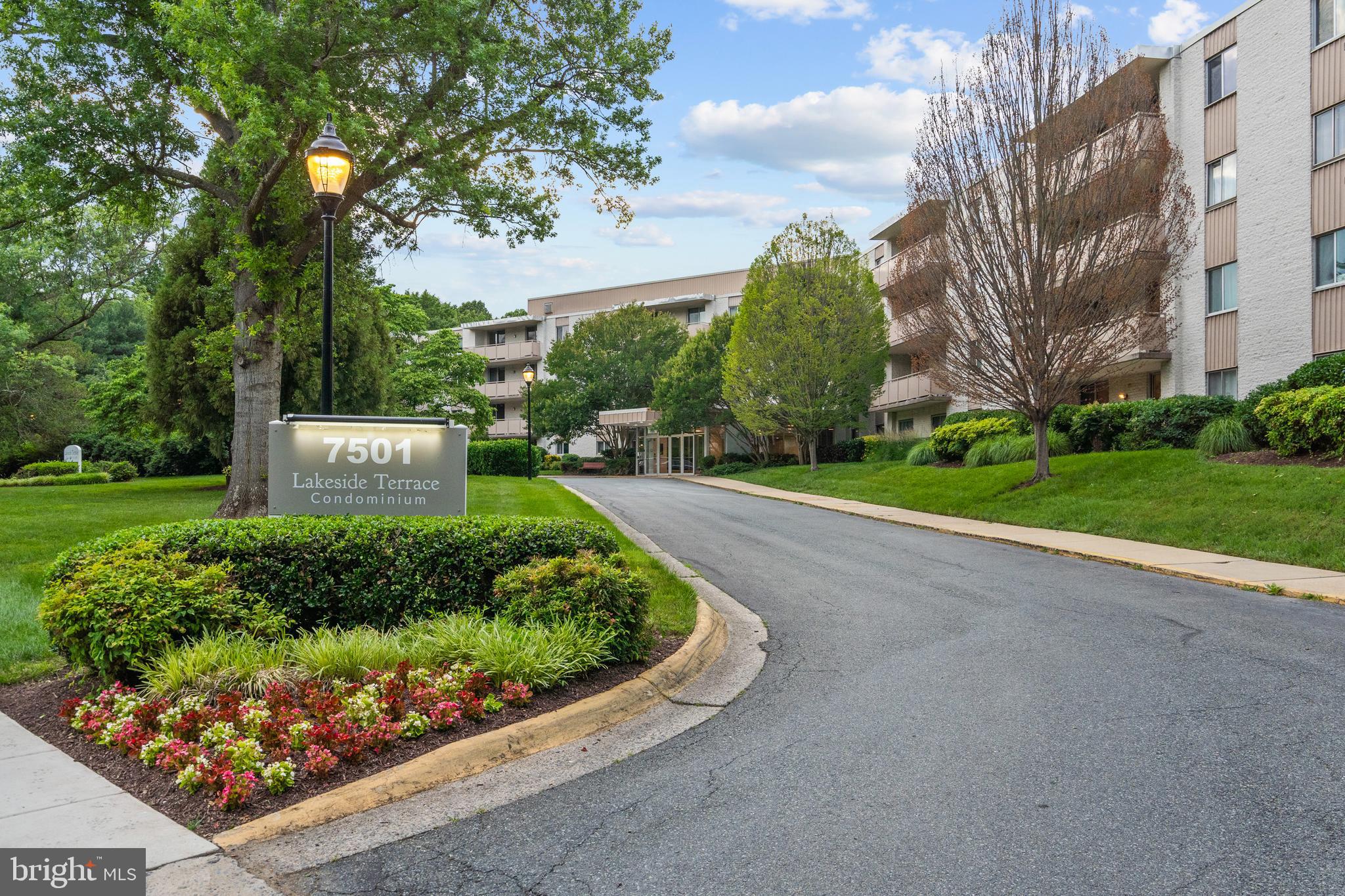 Extraordinary condo, phenomenal community! Conveniently located in one of Bethesda’s most vibrant areas, this cherished, gorgeous & bright two-bedroom, lobby-level home offers over 1,150 square feet of comfortable living space with its own huge private patio, separately deeded garage parking steps from the elevator, extra storage, and amenities galore! The stunning renovated kitchen boasts beautiful white cabinetry, breathtaking quartz countertops & continuous backsplash, and stainless-steel appliances while the primary bedroom has a colossal walk-in closet and its own access to the beautifully updated bath, complete with double vanity. Natural light floods the space thanks to two sets of crystal-clear double-pane sliding glass doors in the open living area & recently upgraded windows throughout. Gleaming LVP flooring, fresh paint, crown molding, and luxurious textured carpet in the two large bedrooms are only a few of its other charms! The Lakeside Terrace community is alive with walking trails, a picnic area with picture perfect views of the lake, a lifeguard monitored swimming pool, & tennis courts, plus social events like movie-nights, bingo, and cookouts. An easy walk to neighboring Cabin John Park, Westfield Montgomery Mall, & the Pauline Betz Addie Tennis Center, only minutes to I-495 & I-270, Metro, NIH & Walter Reed!