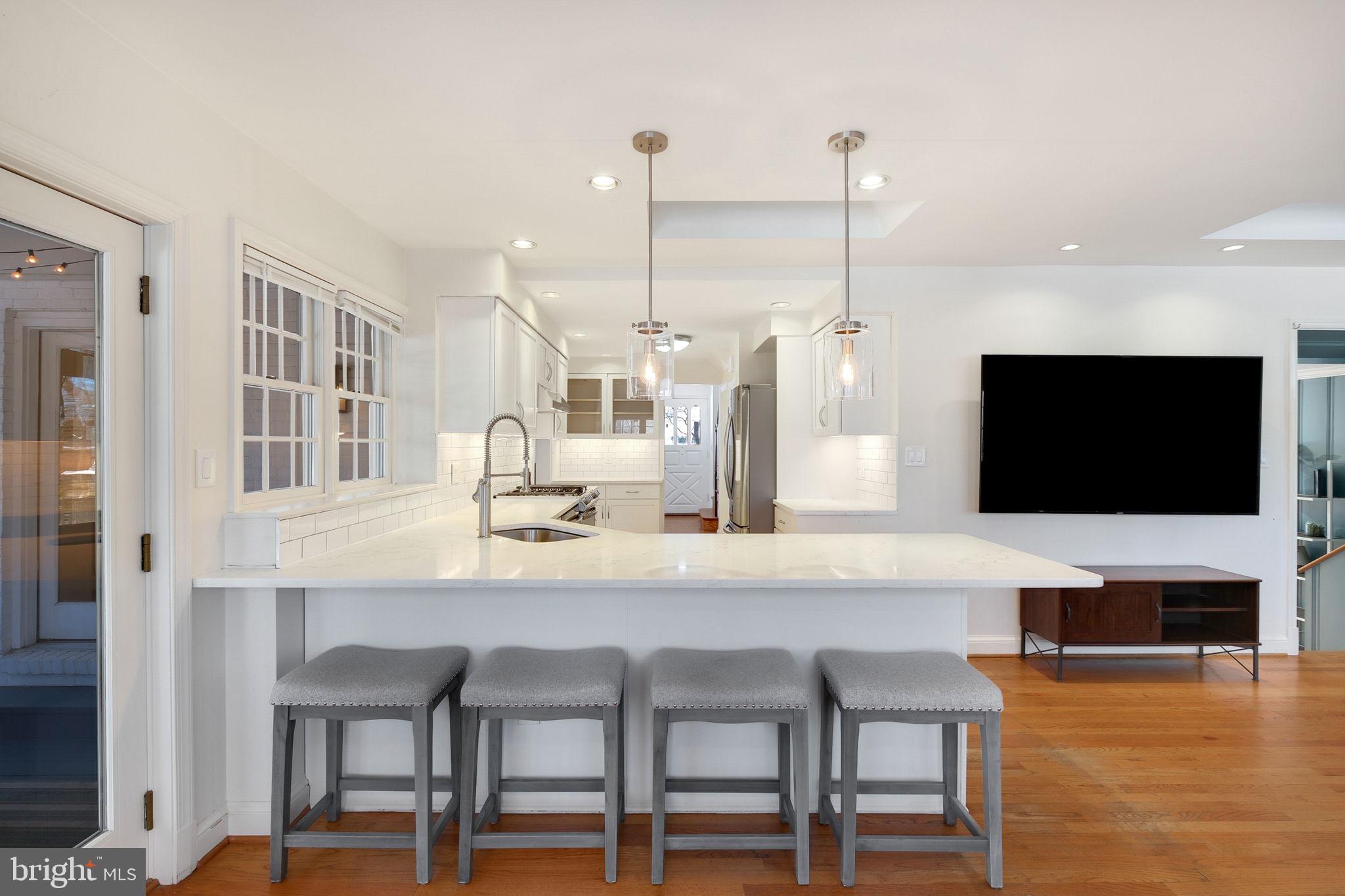 BEST lot and location in downtown Bethesda!! Just what you were looking for!!! An exceptional residence radiates warmth, sophistication, and functionality with an array of thoughtfully curated updates. The heart of the home is the chef’s kitchen, which features brand-new stainless steel appliances, exquisite Quartz countertops, and elegant finishes that seamlessly marry style and practicality. Adjacent to the kitchen, a formal dining room offers a welcoming space for hosting memorable gatherings, while a sunlit home office with direct outdoor access provides the perfect combination of comfort and convenience. The living room, centered around a cozy fireplace, creates an inviting atmosphere to relax and unwind.

Upstairs, the primary suite serves as a serene, remodeled spa-like retreat, complete with an oversized shower, a luxurious soaking tub, and dual vanities for added comfort. A spacious, light-filled second bedroom complements the upper level, offering charm and versatility.

Designed for both entertaining and everyday living, this home offers an array of inviting spaces, including a skylit screened-in porch overlooking a sprawling, fully fenced backyard—an ideal space for outdoor relaxation, gatherings, or play. The full basement enhances the home’s practicality, with a brand-new washer and dryer alongside abundant storage spaces.

Situated in a prime Bethesda location, this property is just a stroll away from the Bethesda Metro and the vibrant shopping, dining, and entertainment options of downtown Bethesda. Welcome to 5407 Lambeth Road where elegance meets comfort, designed to suit your lifestyle.  And best of all….. 2 and a quarter percent assumable loan!!!