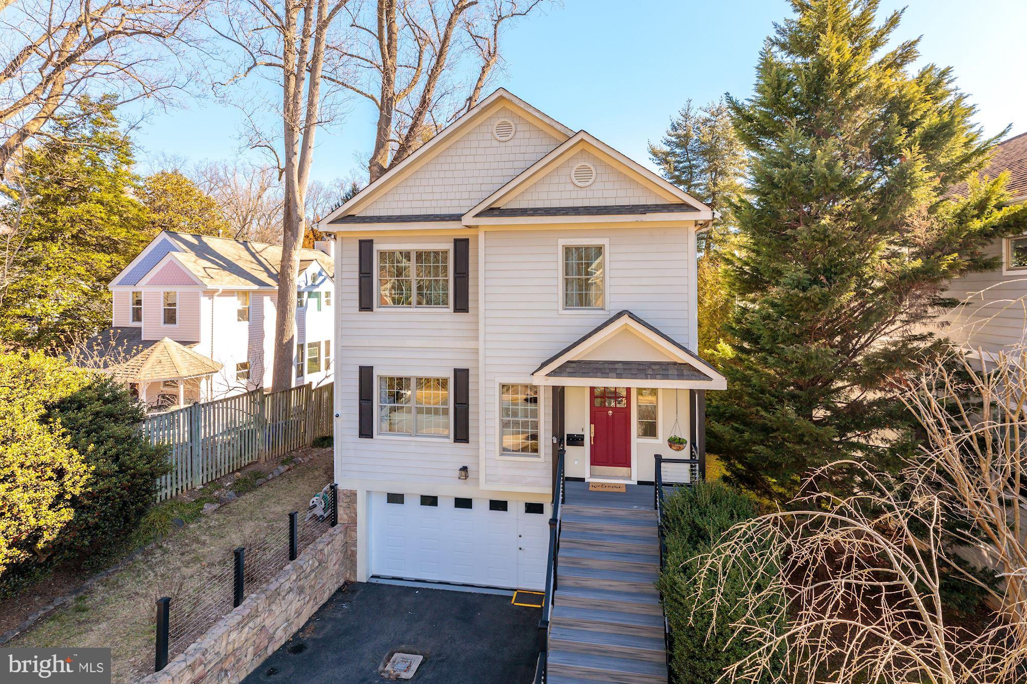 Wonderfully updated Craftsman with an unbeatable location that's only one light to DC! The sunny and open main level features a living room, formal dining room, family room, screened-in porch and a beautifully renovated kitchen with top-of-the-line appliances and quartzite counters. The owners' suite offers a sitting room, large walk-in closet and a luxurious en suite bath. Three additional bedrooms and a laundry room complete the upper level. The walkout lower level offers a large recreation room that opens to the private and fully-fenced backyard with a deck, patio and lawn. Only a short walk to 19-acre Fort C.F. Smith Park that offers ornamental gardens, recreational spaces and walking trails.