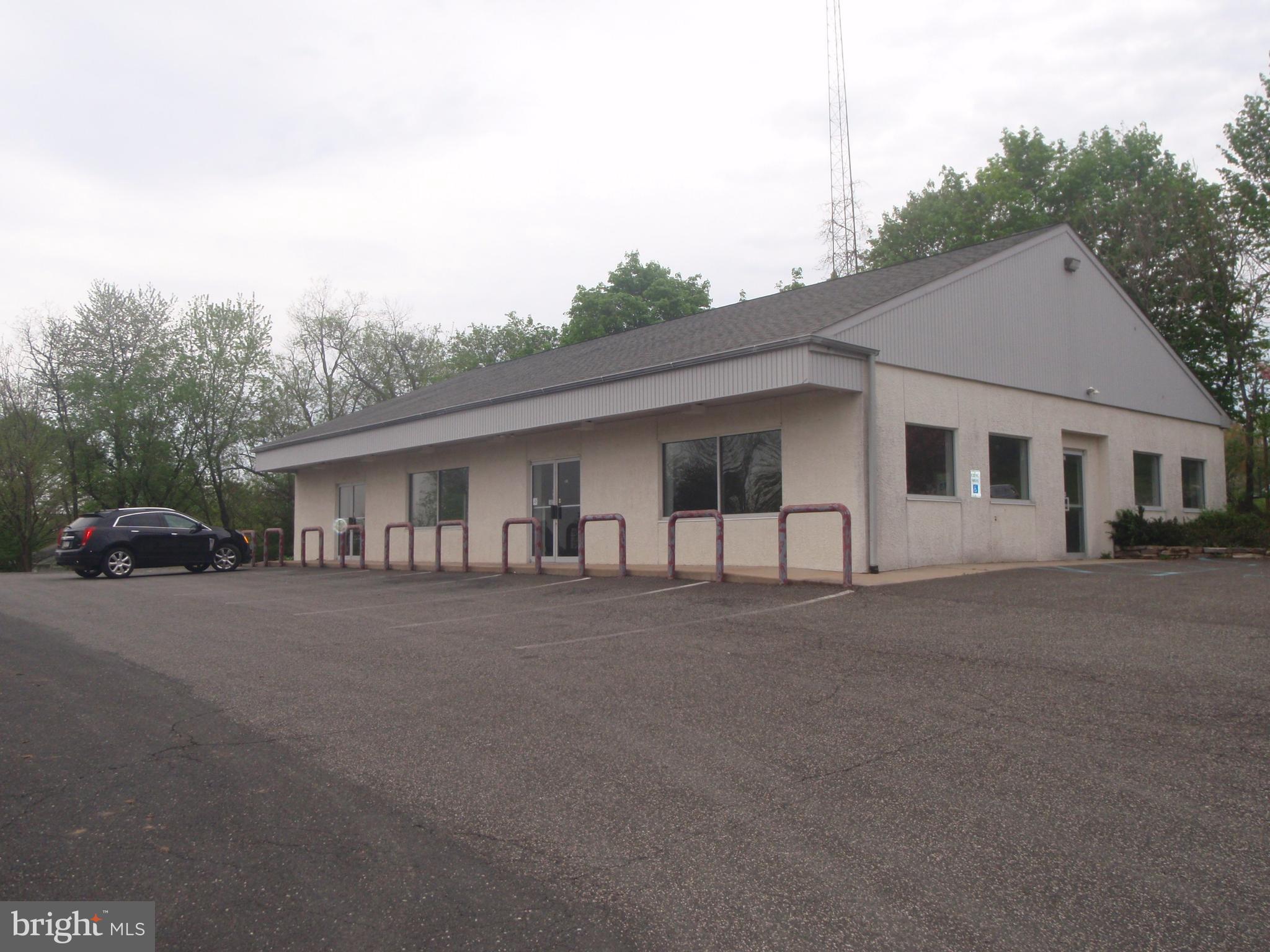 Unique property ( two parcels ).  Rear property has detached garage.  Front property has 3200 sf retail building.   Adjoins vacant lot area . There was large oil storage tank on this site which has been removed.  DEP documents showing approved removal. See survey which shows existing building close to northern property line.  Building is clear span and was used for retail sales.  Building can be leased as a stand alone with existing parking.