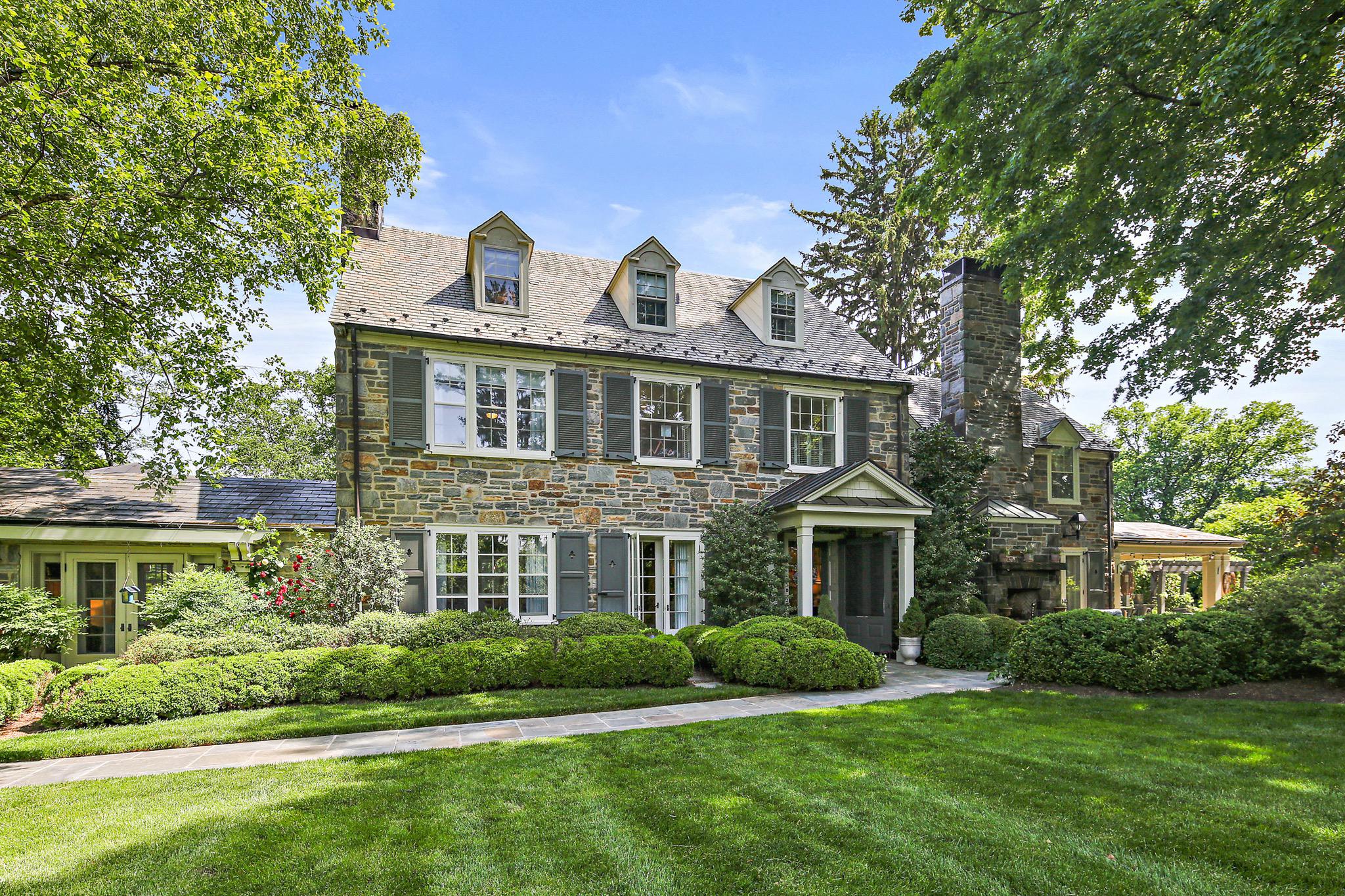 PRICE Improvement - Pendleton. Presenting an exquisite stone residence designed by Howard Frazier Baldwin for LTC Wm. Armistead Pendleton, III in 1937. With an extensive, unparalleled renovation in 2008 and thoughtful additional upgrades from then on, this grand residence is an evolving fusion of classical architecture and contemporary elegance situated atop a grassy knoll in Ruxton. It is a sanctuary of tranquility, secluded within 2.73 acres of a flawlessly designed landscape featuring sweeping lawns, mature vegetation and meticulously curated formal gardens with an extraordinary pool setting. 

Enter the main entrance and embrace the harmonious blend of traditional architectural elements coupled with striking modern enhancements. The graceful curved archways, sky-high window walls, gleaming lacquered wet bar and superior custom cabinetry throughout is a delight to the discerning homeowner while the advanced lighting and sound systems add an appreciable level of refinement.

The main level consists of a foyer with a newly built custom designed alcove with banquette seating and wall sconces, a formal living room overlooking the outdoor dining pavilion and in-ground, heated pool, a separate, elegant dining room and a dreamy chef’s kitchen replete with a distinctive Provence Blue La Cornue stove. Adjacent to the kitchen and dining room is a soaring addition with window-clad walls, a lavish lacquered bar, a cozy petite dining area and a family room with a gas fireplace flanked by custom cabinetry.

The two upper levels provide five generously sized bedrooms and four full baths. The Primary Suite exudes an understated grandeur with an abundance of custom designed functional lighted cabinetry and a refuge-like Primary bath. The remaining four bedrooms, two of which are ensuite, offer ample space for family and friends. All are comprised of exquisite finishes, custom cut and bound carpeting and superior design elements that speak to both the traditional and modern tastes. 

The owner of this exceptional property will also enjoy a magnificent two story Pool House that is truly an architectural masterpiece! The covered porch welcomes you inside to a bright interior main level with an open living room area with vaulted ceilings and a wood burning fireplace, a full kitchen with island and a large dining area encircled by tall windows and banquette seating. There is also a beautiful full bath with a walk-in shower and tastefully designed personal cubbies. Another full-size wet bar complete the entertaining ensemble. The lower level houses ample room for another bedroom, home gym or ultimate game zone and a quaint potting room for the avid gardener.

Finally, the car collector’s two story garage provides every amenity associated with the hobby and additional space on the upper level to design a separate guest suite for weekend or holiday visitors. If you ever do leave this paradise, you will most assuredly always look forward to coming home!

EXCLUDED: Drapery treatment in the Dining Room. Sold AS IS.