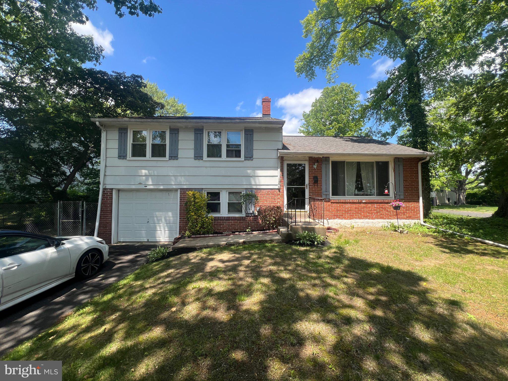 Welcome to this charming 3-bedroom, 1-full and 2-half bath split-level home located in the peaceful and highly desirable Abington Woods neighborhood. Situated on a lovely 0.2-acre lot at 1346 Clarke Rd, this property boasts spacious front, side, and rear yards filled with lush greenery and mature trees that provide wonderful shade during the warmer months.

The classic split-level design offers a highly functional layout. On the main level, you will find a bright living room, a functional kitchen, and a separate formal dining room perfect for gatherings. The lower level includes a dedicated laundry room, a convenient half-bath, access to the attached garage, and direct access to both the side yard and a serene rear sunroom that opens out to the quiet, grassy backyard. Upstairs, the home features three comfortable bedrooms, including a main hallway full bathroom and a private half-bath tucked away in one of the bedrooms.

This home has been well-loved and is now ready for its next chapter, offering the perfect opportunity for buyers to bring their own personal style and vision to transform it into their ultimate dream home. Nestled in a calm and welcoming community while still being close to all the conveniences of Abington, this property holds incredible potential. Schedule your tour today to explore the possibilities!