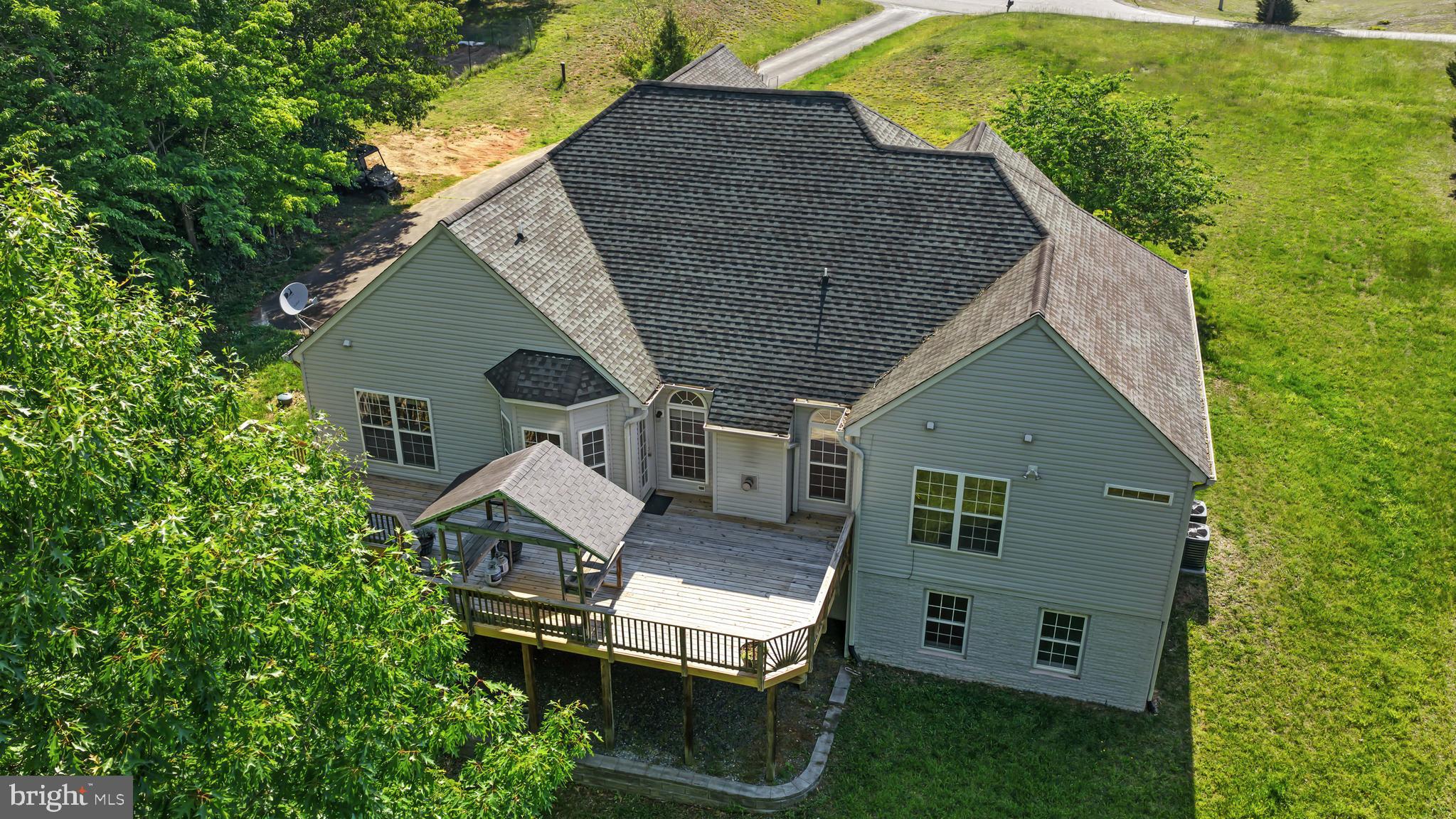 (See Aerial View Video) Nestled on 3 private acres with its own exclusive trail leading directly to the serene waters of the Rappahannock River, this extraordinary property offers the ultimate nature retreat while blending modern comfort with peaceful seclusion. Surrounded by mature trees and tranquil scenery, this beautifully updated home is designed for those who appreciate both luxury and outdoor living.

Inside, the home has been thoughtfully renovated throughout with stylish modern finishes. The stunning kitchen features elegant quartz countertops, new porcelain flooring, brand-new stainless steel appliances, pendant lighting, and abundant space for cooking and gathering. The dining room is highlighted by a sophisticated modern chandelier, while updated fixtures throughout the home create a fresh, contemporary feel. The main bathroom has been completely refreshed with a beautifully updated shower and sleek glass door, while the additional bathrooms feature upgraded countertops, ceramic floors and faucets. New dual zone HVAC , fresh paint and new carpeting throughout make the home truly move-in ready.

Designed with both comfort and functionality in mind, the main level offers multiple bedrooms and three full bathrooms, creating an ideal layout for families or multi-generational living. The lower level includes an additional bedroom and full bath, providing the perfect guest suite or private retreat.

The expansive lower-level recreation room offers endless possibilities, featuring ample space for a personal theater, game room, fitness area, or entertainment lounge. A wet bar makes hosting effortless and adds to the home's exceptional entertaining appeal.

Step outside to enjoy the oversized rear deck just off the kitchen, where you can relax and take in the breathtaking forest views and peaceful surroundings. A dedicated barbecue area creates the perfect setting for outdoor dining, gatherings, and evenings under the stars.

For nature lovers and outdoor enthusiasts, this property is truly one of a kind. Follow your private trail down to the calm waters of the Rappahannock River, where you can spend your days canoeing, fishing, or simply enjoying the beauty of the riverfront setting. As an added bonus, the owner is even including an off-road vehicle to help you fully experience and enjoy the property's incredible outdoor amenities.

This is more than a home — it is a private retreat where modern living and nature come together in perfect harmony.