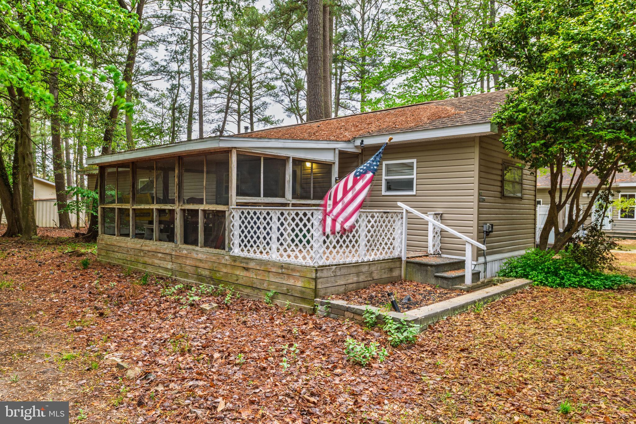 Coastal living meets quiet, wooded privacy in White House Beach. This well‑kept 2‑bedroom, 1‑bath single‑wide sits on a beautiful, tree‑lined lot that offers rare tranquility just minutes from the bay. Enjoy your mornings and evenings on the large screened‑in porch, perfect for relaxing, dining, or taking in the natural surroundings without the bugs.

Inside, the home offers an efficient layout with a comfortable living area, functional kitchen, and two cozy bedrooms. Whether you’re looking for a full‑time residence, a beach getaway, or an affordable investment property, this home delivers excellent value in one of the area’s most desirable leased‑land communities.
Contingent on park approval. 
Monthly lot rent: $901