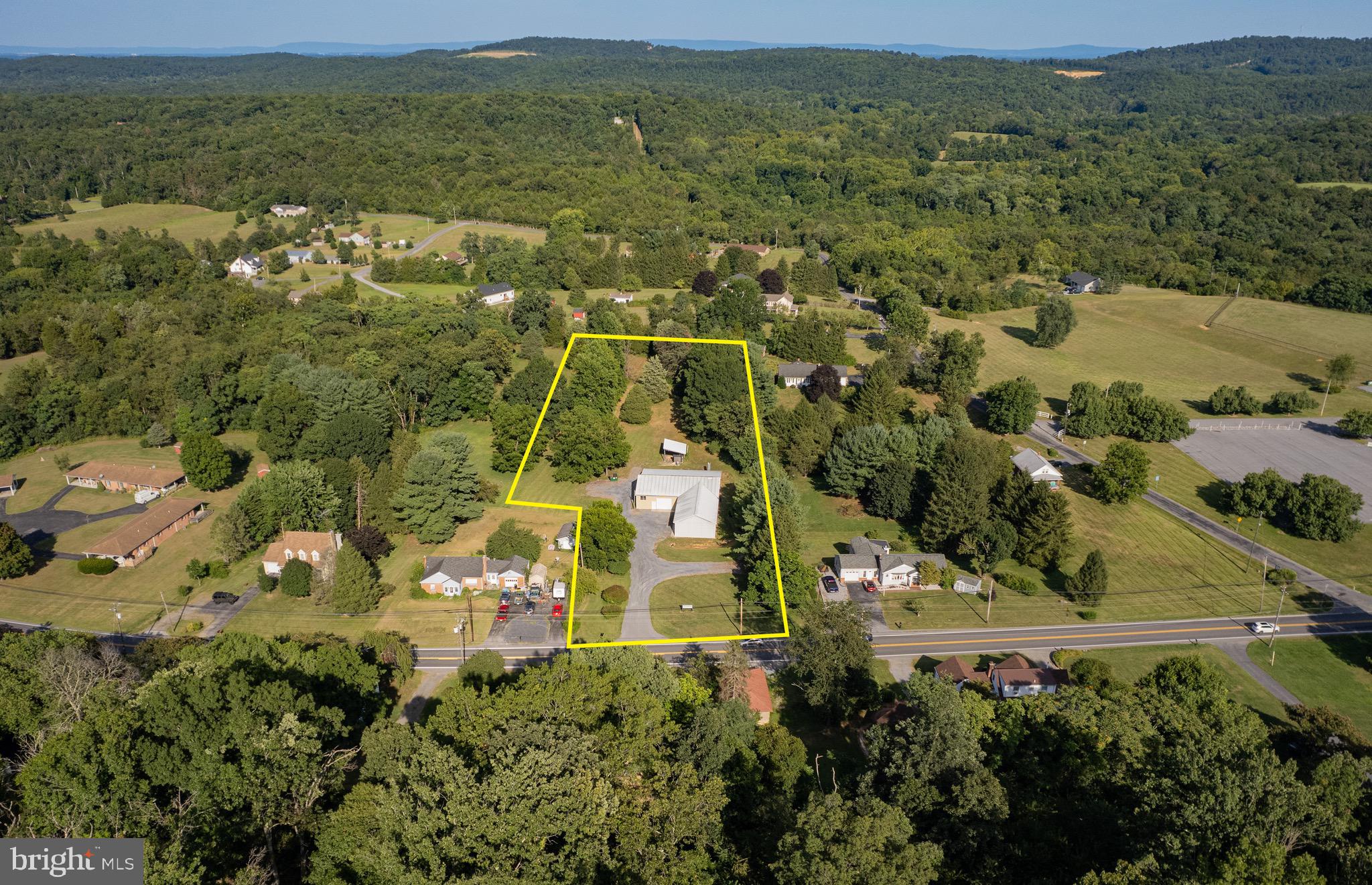 SELLERS OFFERING UP TO 10K IN PURCHASERS CLOSING COST! Warehouse and/or Flex Space with high traffic county and road frontage on Route 9 in Hedgesville, WV. The property offers a total of 5,536 (+/-) square feet of space. The building is a pole construction and is a largely open warehouse space with approximately 364 (+/-) square feet of newly renovated office space. The property features three overhead doors and is serviced by three phase, 400 amp electrical service. The building is heated by an external wood furnace, hot water forced warm air heat. The building is served by private well and septic. Additionally there is a newer 18 X 24 shed for wood storage adjacent to the externalwood furnace on the property.