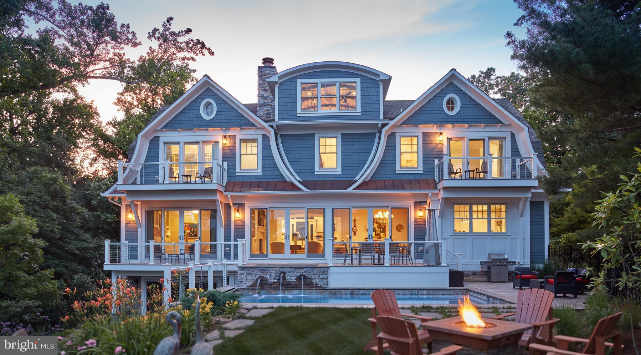 Stunning 7500sqft Nantucket style home designed by Cathy Purple Cherry. 1st flr master suite, gourmet chefs kitchen w/coffered ceiling, marble counter tops&custom cabinets. Hand-scraped hickory flrs and custom trim work throughout. Circular stairs to barrel-vaulted library. LL w/ wine cellar,fam rm, game rm & gym. Deck, waterside pool and hot tub make this an entertainer's delight.  Pier w/2 slips