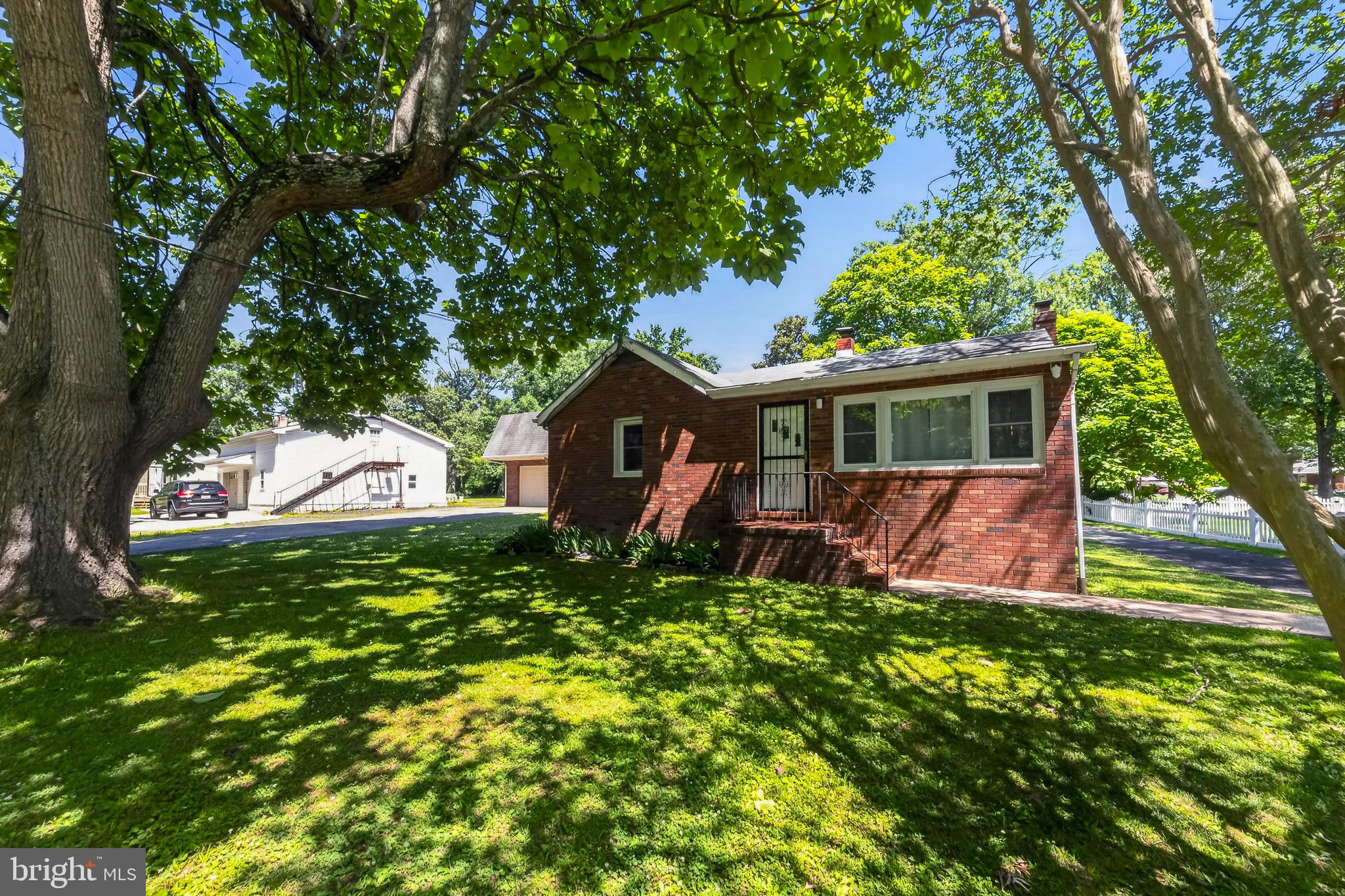 At first glance, this Holly Neck rancher checks the usual boxes — wide-plank hardwood floors, bedrooms filled with afternoon light, a wall of windows opening the main living space to a wooded backdrop. The lower level is unfinished but ready to work for you, laundry and mechanicals set aside, open square footage left for whatever comes next — home gym, playroom, media room, your call. Solid. Comfortable. Exactly what you'd expect. Then there's the detached garage sitting right next to the house. Head toward it, and you'll quickly realize there's a lot more happening than a place to park the car — upstairs, downstairs, and in ways most buyers don't expect until they're standing in it themselves. We're not going to spell it all out here. Some things are better experienced in person.
Tucked into Essex's Holly Neck area, this address sits in one of the region's quieter, tree-canopied pockets, the kind of neighborhood where mornings are shaded by mature hardwoods and evenings are just plain peaceful. Holly Neck has built its reputation on proximity to the water, walkability, and a slower pace, while still keeping you close enough to Essex's shops, restaurants, and the greater Baltimore area for an easy commute. Neighbors here talk about the trees, the birds, and the bay in the same breath — a rare combination this close to the city. It's worth asking what else this pocket of Essex has in store once you're standing in the driveway looking around.
Photos can only tell you so much — and this property has more layers than most. If you're curious what's really going on behind that garage door, or what the rest of this Holly Neck lot has waiting for you, there's only one way to find out. Call today to schedule your private showing before someone else beats you to it.