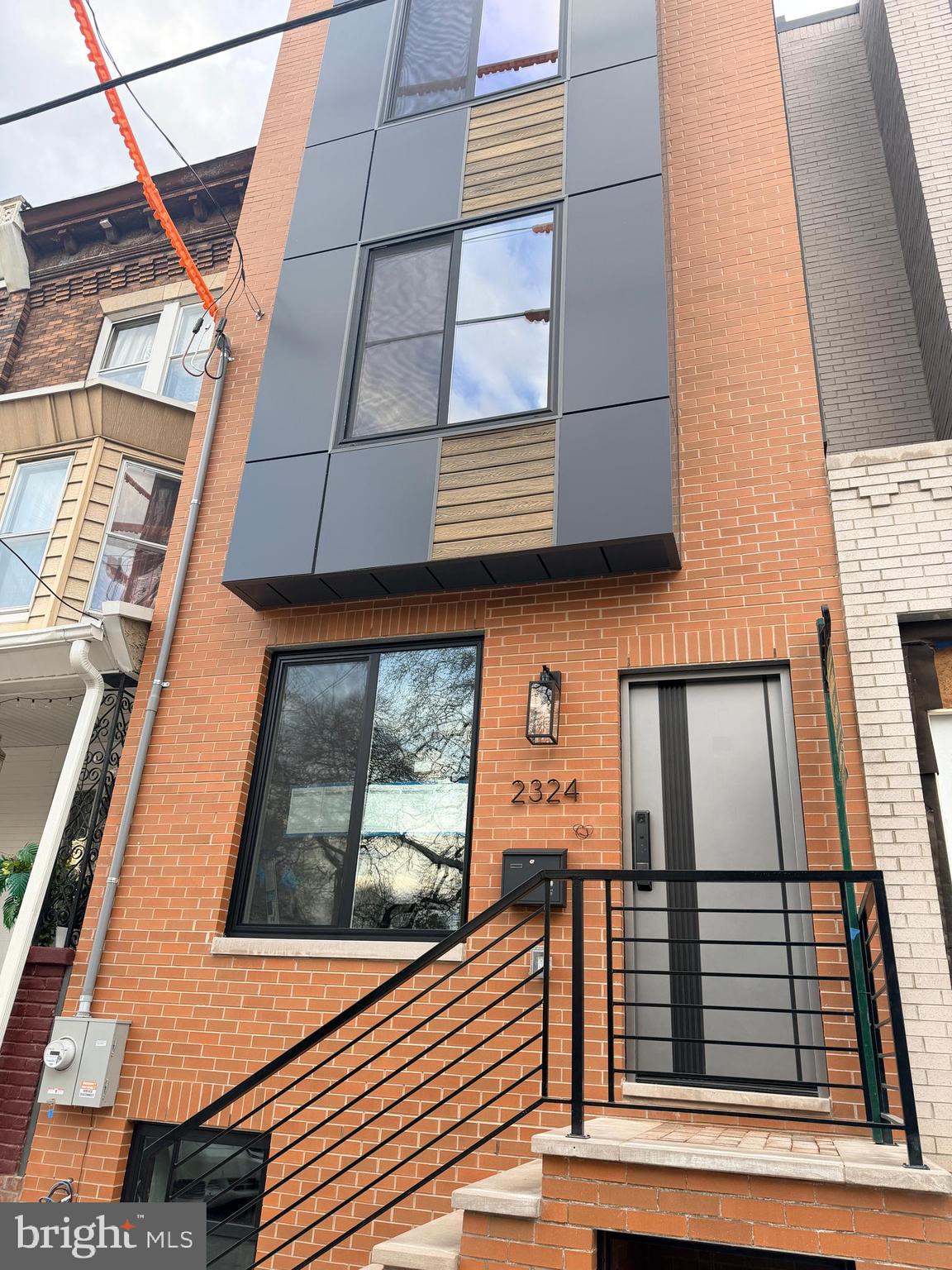 Opportunity to own New Construction, Four Bedroom, Four Bath, Roof Deck, Park View, Hardwood Floors, Modern Kitchen in South Philadelphia.
Almost complete custom-built-across from Wharton Square Park in the vibrant Point Breeze / South Philadelphia with convenient access to Center City. This newly constructed residence features wide-plank hardwood flooring throughout, custom millwork, detailed wainscoting, and designer LED  accent lighting.
The open living and dining areas flow into a modern kitchen designed for everyday living and entertaining. Bathrooms are finished with large-format tile and contemporary fixtures, and smart toilets, creating a cohesive and refined interior. Spacious bedrooms are arranged across multiple levels providing flexible living space.
A rooftop deck offers outdoor space with city and park views. Convenient to dining, shopping, and public transportation. Across from Wharton Square Park, two tennis courts, splash pads, volley ball, playground & dog friendly. Easy access to major highways and Philadelphia International Airport. Located near major medical centers including Hospital of the University of Pennsylvania and Children's Hospital of Philadelphia. Reimagined Photos.
