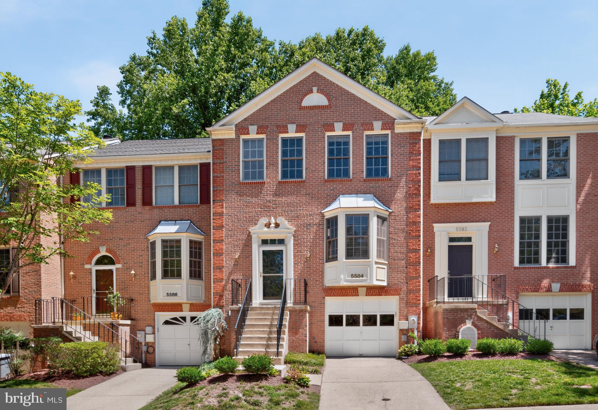 Rarely available 3-bed, 2-full and 2-half bath townhome offering over 2,200 square feet and an attached 1-car garage in the sought-after Dorsey's Search community. The light-filled main level features hardwood flooring throughout and an open layout that seamlessly connects the kitchen, dining, and living areas. The fully remodeled gourmet kitchen (2021) is the heart of the home, boasting white shaker cabinets, quartz countertops, stainless steel appliances, including a cooktop with range hood, and bar-height seating. A sunlit breakfast area with a beautiful bay window offers picturesque views of the wooded rear yard. The spacious living and dining rooms share a 3-sided wood buring fireplace, connecting the two areas and perfect for hosting friends and family. A convenient powder room is located nearby. Upstairs, the large owner’s suite impresses with a vaulted ceiling, lighted fan, walk-in closet with built-in shelving, and an updated en-suite bath (2021) featuring a dual sink vanity and a stand-up shower with a frameless glass door. Two additional bedrooms with elevated tree-top views share a full bath with tub-shower combo. The versatile lower level offers a large rec room with a second wood-burning fireplace and walk-out access to the rear yard,  perfect for a home gym, office, or cozy movie night in, with an additional half bath, laundry, and storage for added convenience. Enjoy outdoor living on the rear deck or patio space with no rear neighbors, just what you need to unwind after a long day. Recent updates include: newer roof (2019), HVAC (2021), and water heater (2019), offering peace of mind for years to come! Residents enjoy the perks of Columbia living, including access to select Columbia Association amenities such as neighborhood pools and fitness facilities. Ideally located, this home is just minutes from Howard Community College, Centennial Park, Fairway Hills Golf Club, and Columbia Mall, with nearby lake views, shops, and dining in the vibrant downtown district.
