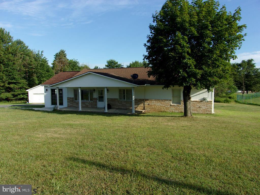 Exceptional ranch home with many living style options. Beautiful oak kitchen with granite counter tops. Open floor plan to the living room with cathedral ceilings. 3 bedrooms or could be a large master bedroom suite. 2 large garages with the biggest being 40x60.  all set on 2.56 acres