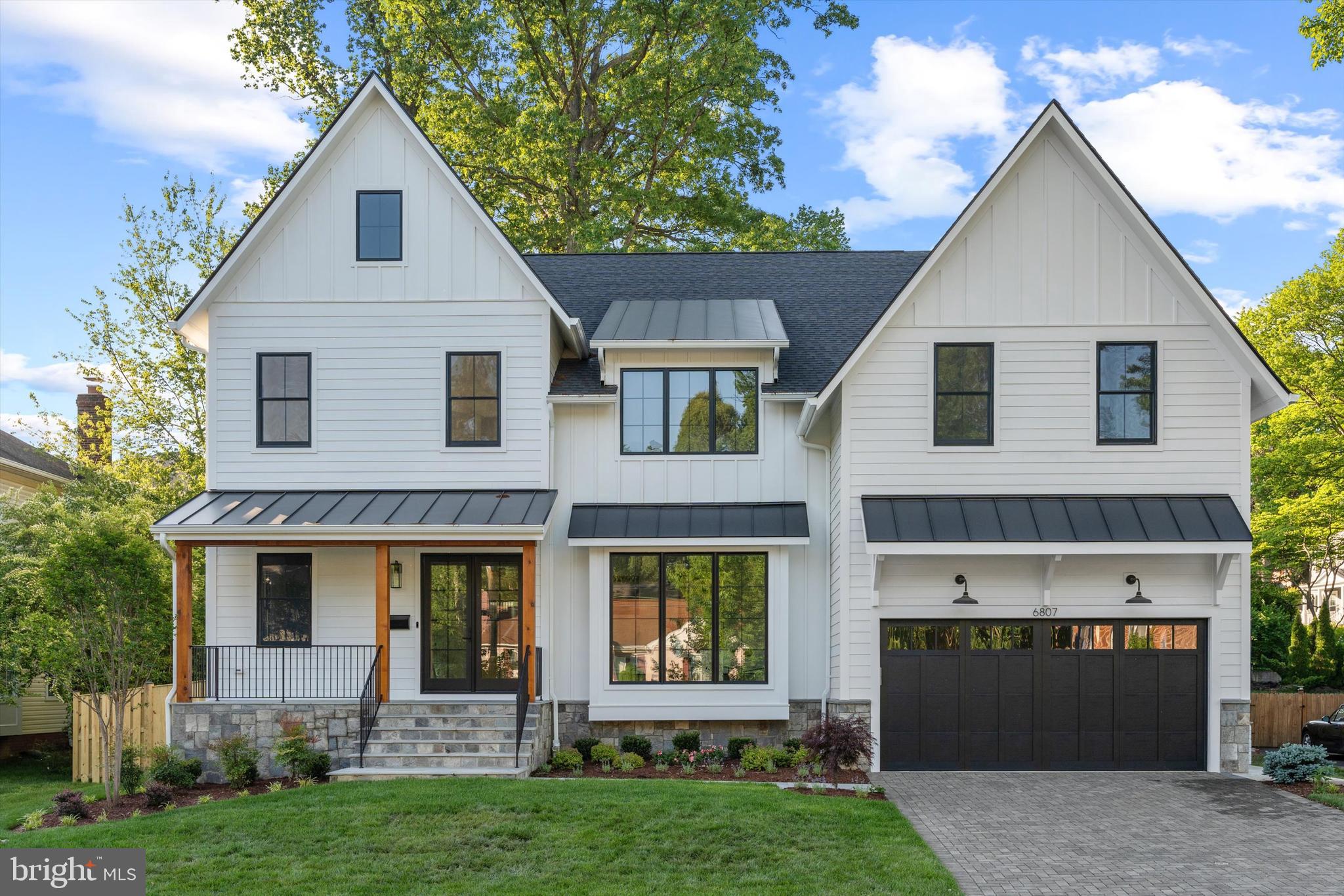 Construction of this Beautiful Home is NOW COMPLETE! 
Set on a gorgeous, 13,560 sq. ft. flat lot with mature trees, this stunning, family friendly backyard will exceed expectations! 
This is NOT your typical builder grade home on the market.   
Zimmermann Homes is an award-winning custom Builder known for building high quality homes that are unrivaled in performance, beauty, and durability. 
All of Zimmermann's standards and building techniques that make their homes attractive, energy efficient, and low maintenance are included!   The designer finishes will immediately jump out as thoughtful, elegant, and luxurious and living here you'll get to enjoy the comfort and efficiency of having a tankless hot water heater, Anderson 400 series windows, LED bulbs, radiant reflective roof sheathing, humidifier, oversized air filters, spray foam band joist, insulated garage door, oversized gutters with gutter guard, 2 sump pumps with battery back ups, pvc exterior trim, and the list goes on.   Upon actually entering this impressive residence, the wide plank white oak floors and 10’ ceilings add to the grandeur of the space while large windows fill each room with natural light.  In its expansive kitchen you'll find Thermador appliances and sleek quartz countertops that will inspire your inner chef.  Each bedroom features ample closet space and their own en-suite bathrooms, and a bonus flex space on Second floor can be used as a second home office, family homework area, or cozy reading spot.  The heart of this new construction Modern Farmhouse though is undoubtedly its tranquil backyard with its expansive amount of usable green space making it a perfect spot to entertain and create lasting memories. The yard is fenced in and nicely landscaped, and the inviting screen porch with electric heaters makes the outdoor space a peaceful place to unwind at the end of each day!  
This prime location allows easy access to Washington DC, 66, restaurants on Broad St. and metro stations. 6807 Williamsburg Blvd offers not just a house but a lifestyle - one that combines luxury living with the convenience and charm of Arlington city life.  This house is attractively priced with what's included and is truly an opportunity not to be missed!  
3-D Tour available to view...click camera reel icon to the top left of listing page to view.