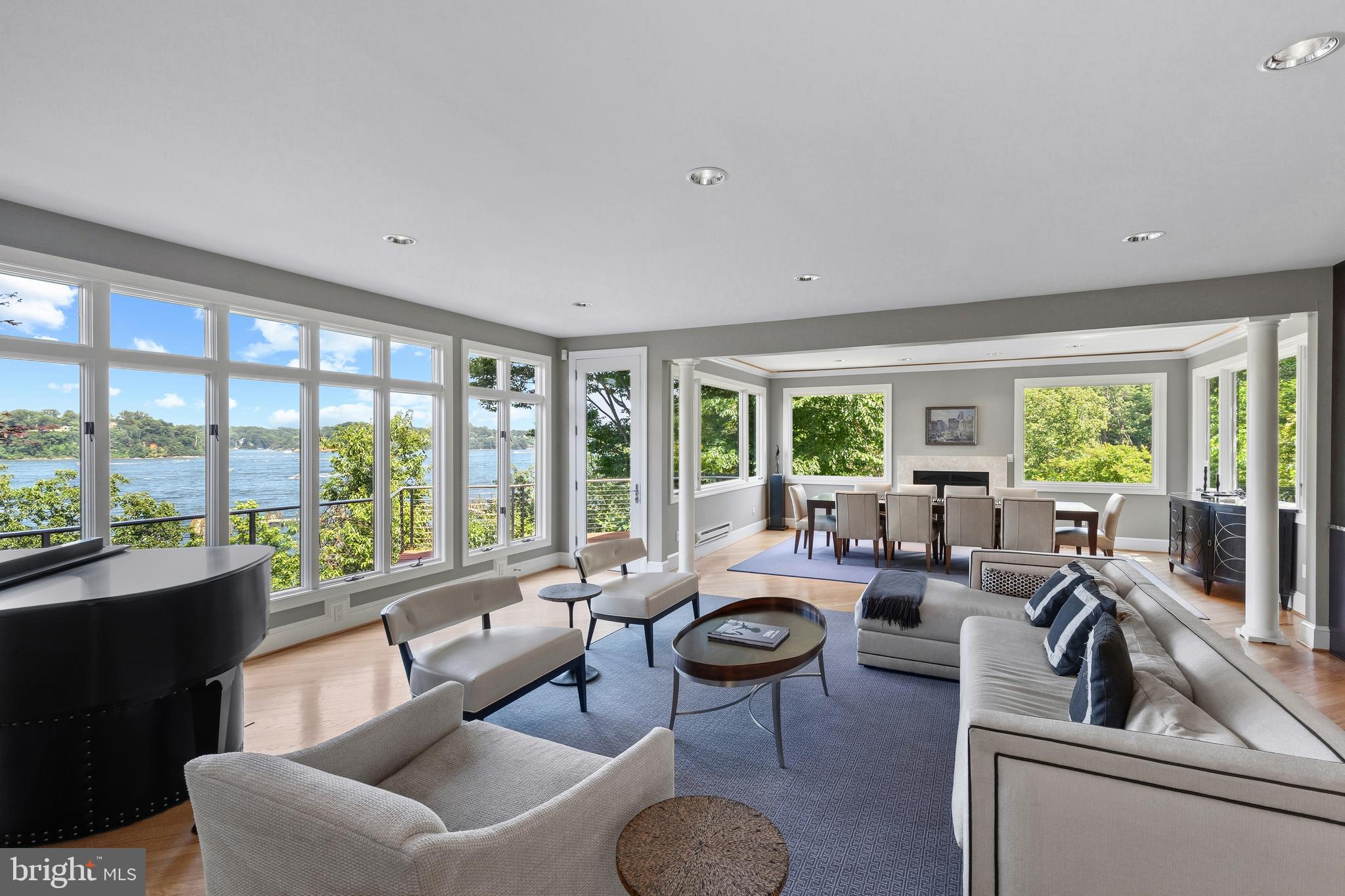 Perched above the Severn River in the gated waterfront community of Epping Forest, this exceptional property captures sweeping water views and effortless indoor/outdoor living just minutes from downtown Annapolis. Thoughtfully designed with an open floor plan and walls of windows, the home is filled with natural light, high ceilings, custom millwork and seamless sightlines to the Severn river from nearly every vantage point.

Expansive ipe decks with sleek cable railing extend the living space outdoors, creating the perfect setting for sunset entertaining or quiet mornings overlooking the water. The primary suite is a true retreat, complete with a private balcony overlooking the Severn; an idyllic perch for enjoying elevated river views and summer breezes. On the lower level, a covered flagstone patio offers an additional outdoor haven, ideal for relaxed evenings, gathering with friends or stepping directly out toward the waterfront.

Inside, beautifully appointed gathering spaces flow easily from the gourmet kitchen to the dining and living areas, offering both comfortable everyday living and gracious entertaining. Three spacious bedrooms, three full baths and two half baths are thoughtfully distributed across four finished levels, providing flexibility for guests, work from home needs or additional recreation space.

The private pier with deep water and two lifts, including a dedicated jet ski lift, invites endless days on the Severn, with quick access to Annapolis waterways and beyond. Ideally positioned close to Epping Forest’s renowned amenities, residents enjoy a clubhouse with waterside dining, marina, sandy beach, boat ramp, tennis courts, walking trails and a vibrant calendar of social events.

An additional 0.115-acre parcel on Sherwood Trail (Tax ID: 224010114205) conveys with the sale and offers convenient supplemental parking, providing easy access for the many guests who will be sure to come visit.

A rare opportunity to embrace panoramic river views, exceptional community amenities and the quintessential Annapolitan waterfront lifestyle. Epping Forest is a Special Tax District ($3,059.47 annually) with binding Rules and Regulations. Welcome Home!